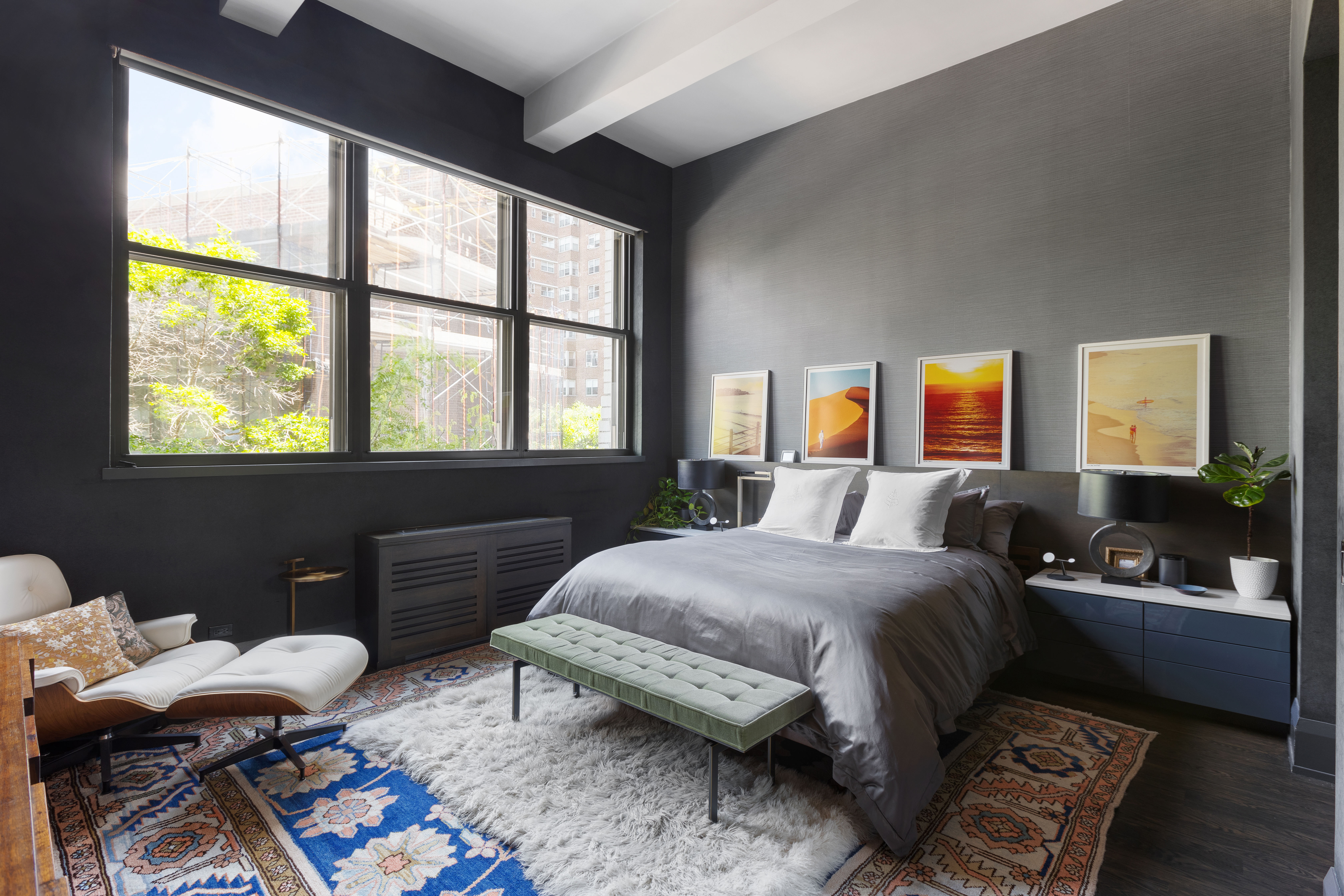 263 9th Avenue, Unit 2E Manhattan, NY 10001 - Photo 4 of 12 a bedroom with a bed and wooden floor