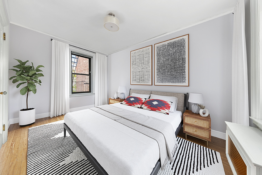 305 East 88th Street, Unit 5G Manhattan, NY 10128 - Photo 4 of 14 a bedroom with a bed and a potted plant