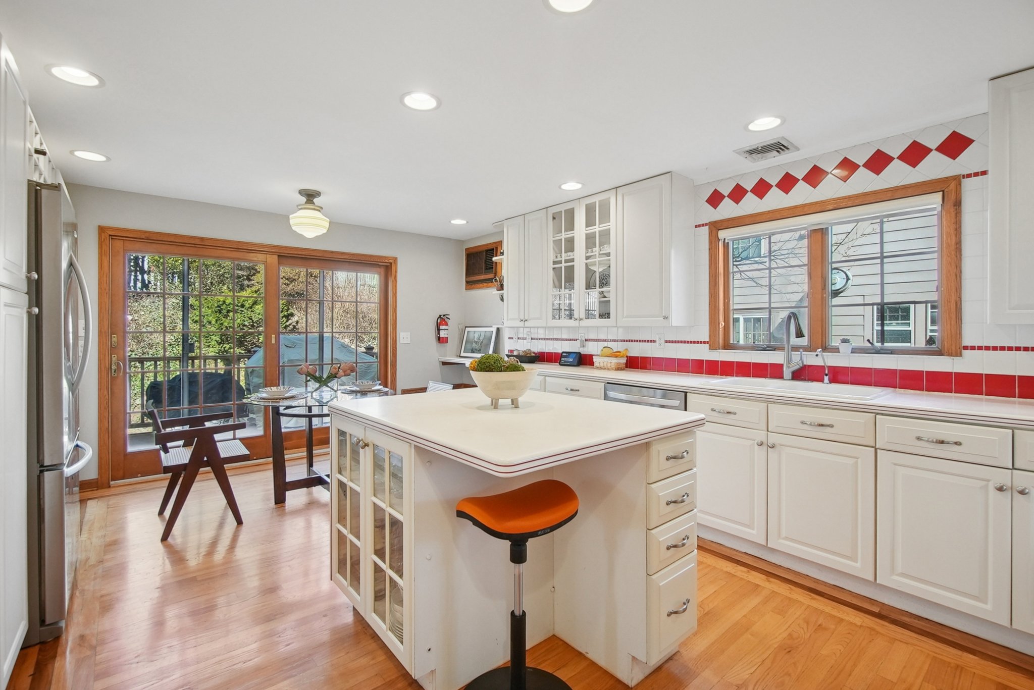 877 Ridgewood Road Millburn, NJ 07041 - Photo 9 of 37 a kitchen that has a lot of white cabinets and wooden floor