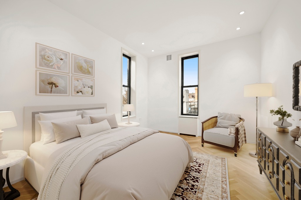 214 Clinton Street, Unit 2E Brooklyn, NY 11201 - Photo 5 of 11 a bedroom with a bed and a couch