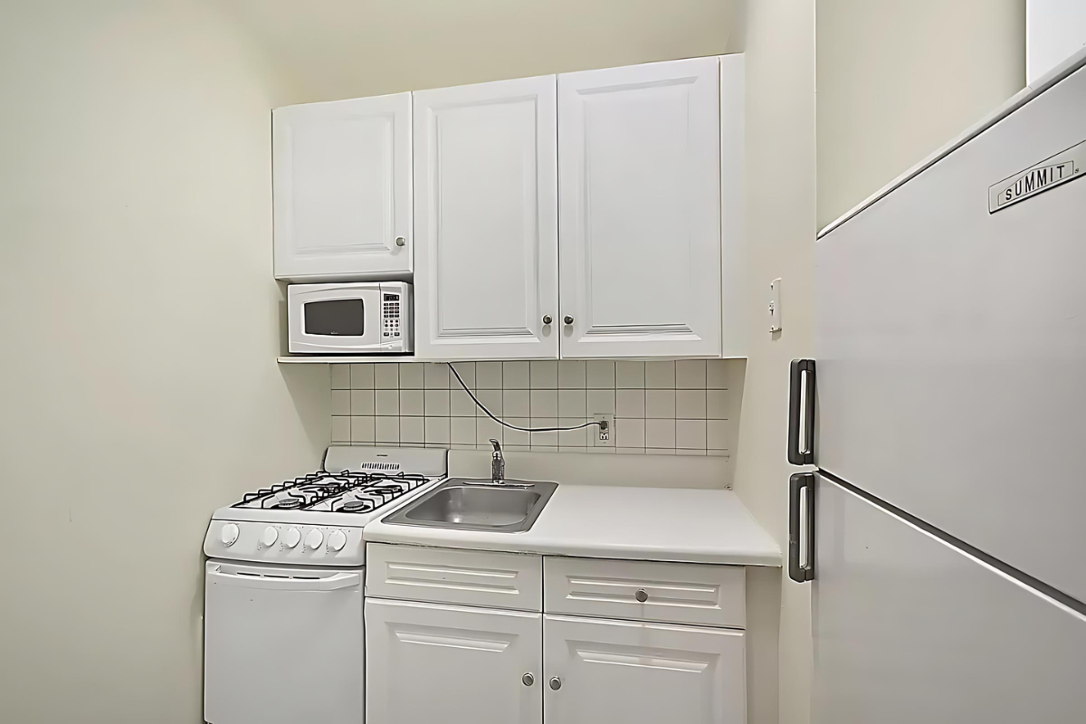 247 East 81st Street, Unit 3E Manhattan, NY 10028 - Photo 4 of 6 a view of storage and utility room with washer and dryer