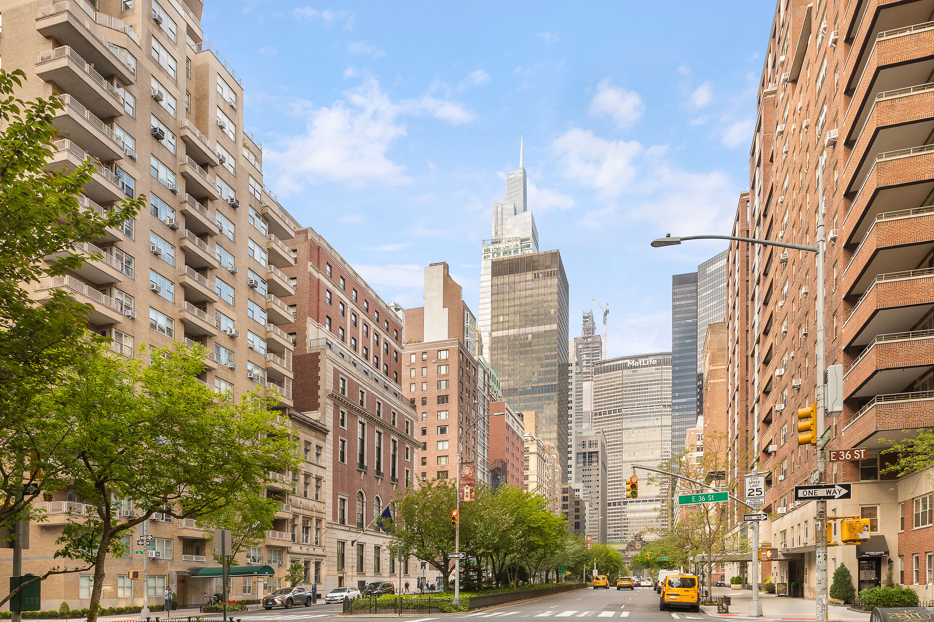 111 East 36th Street, Unit 4A Manhattan, NY 10016 - Photo 17 of 19 a city street lined with buildings and trees