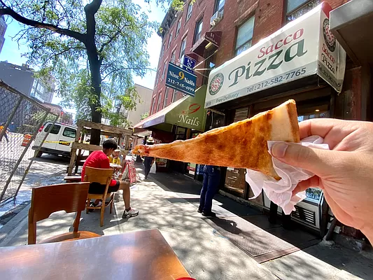 421 West 57th Street, Unit 3C Manhattan, NY 10019 - Photo 15 of 18 a view of a chairs and tables in the back yard of the building