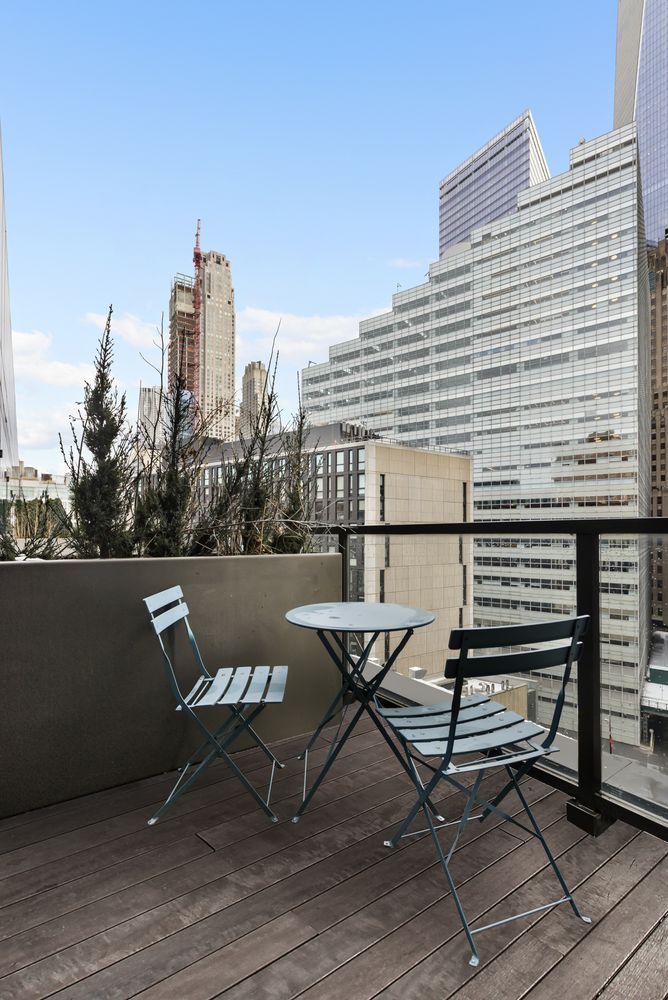 101 Warren Street, Unit 11L Manhattan, NY 10007 - Photo 17 of 26 a view of terrace with seating space and trees