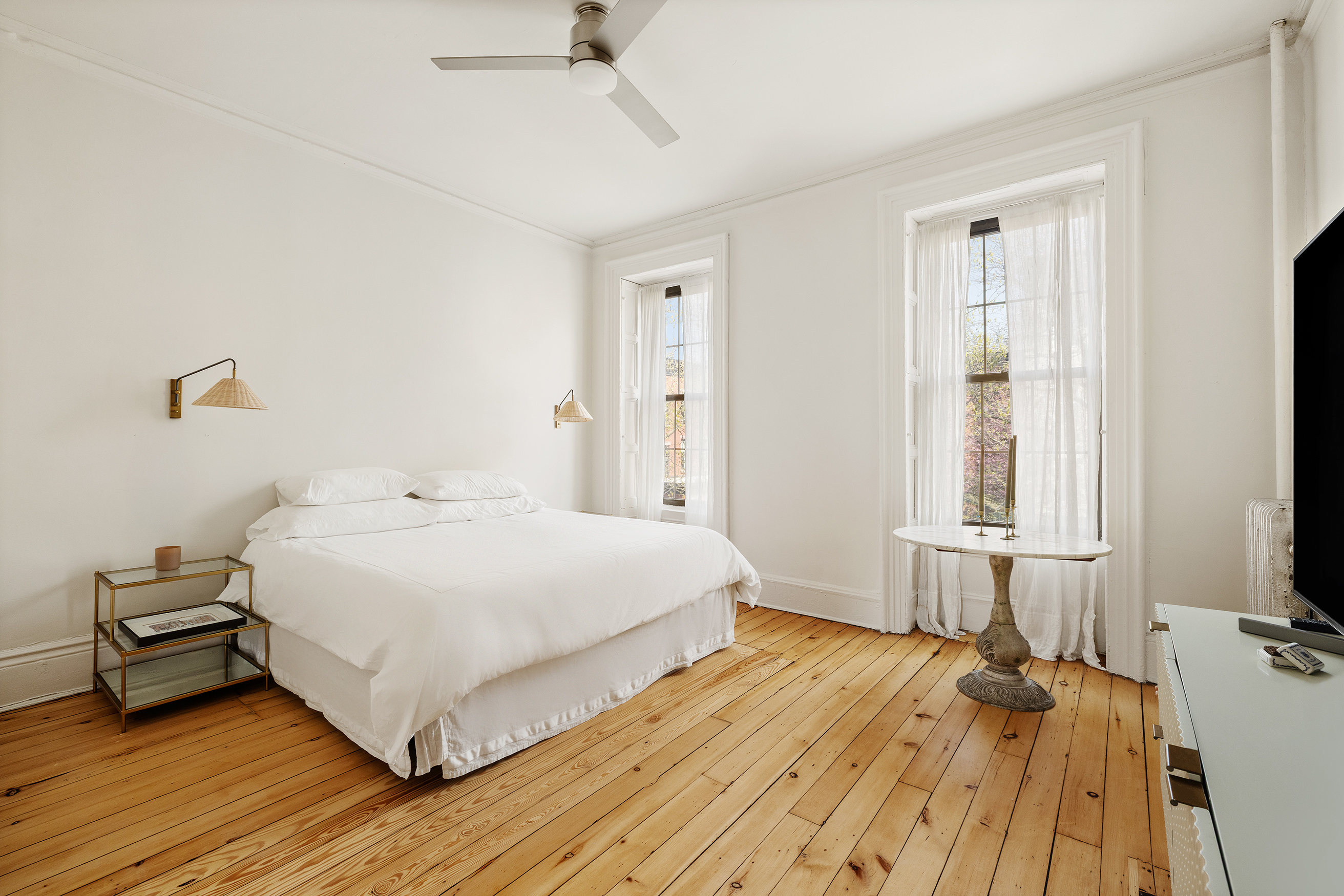 16 Strong Place Brooklyn, NY 11231 - Photo 12 of 19 a bedroom with a bed and a large window