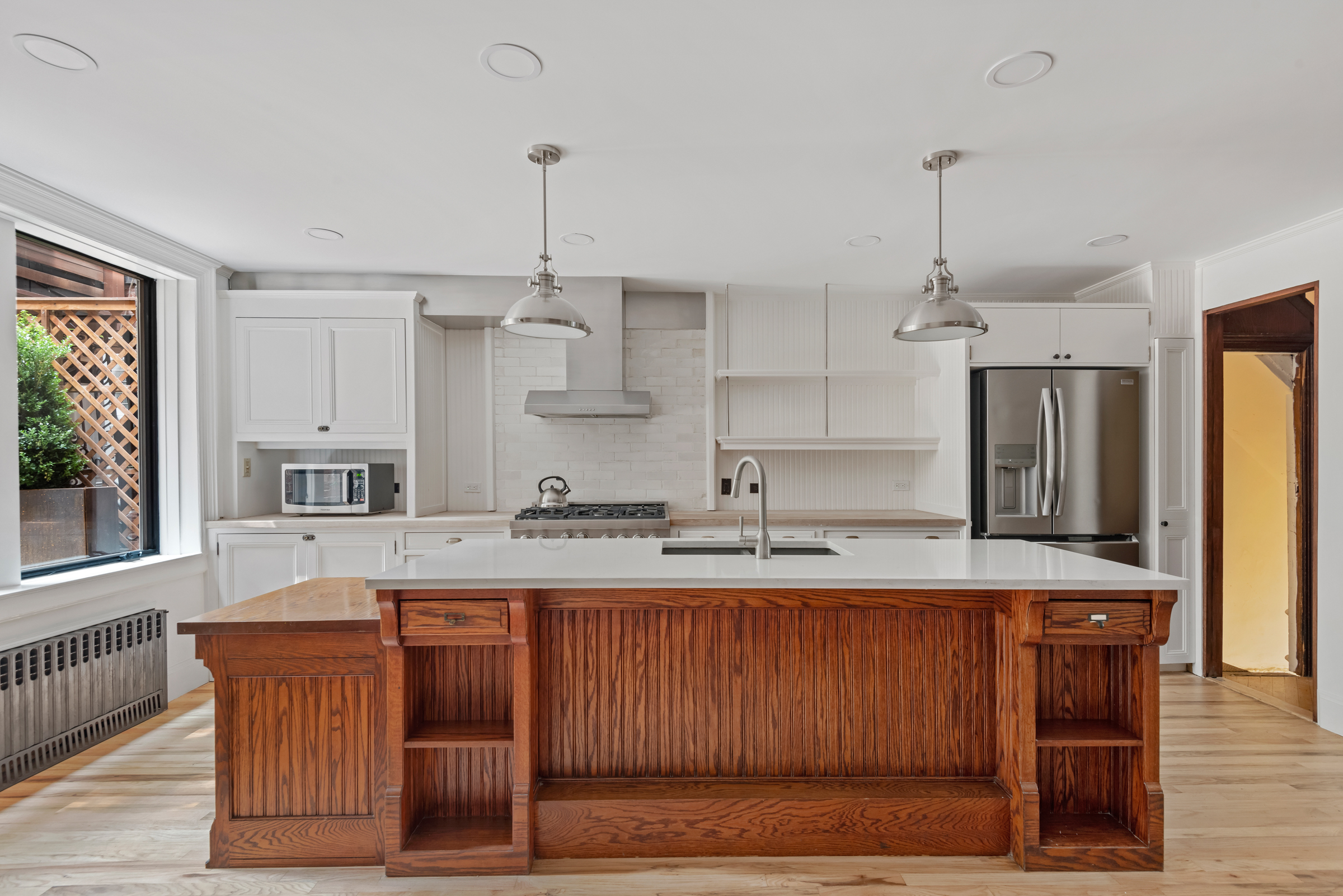 616 2nd Street Brooklyn, NY 11215 - Photo 5 of 19 a kitchen with a stove a refrigerator and a sink