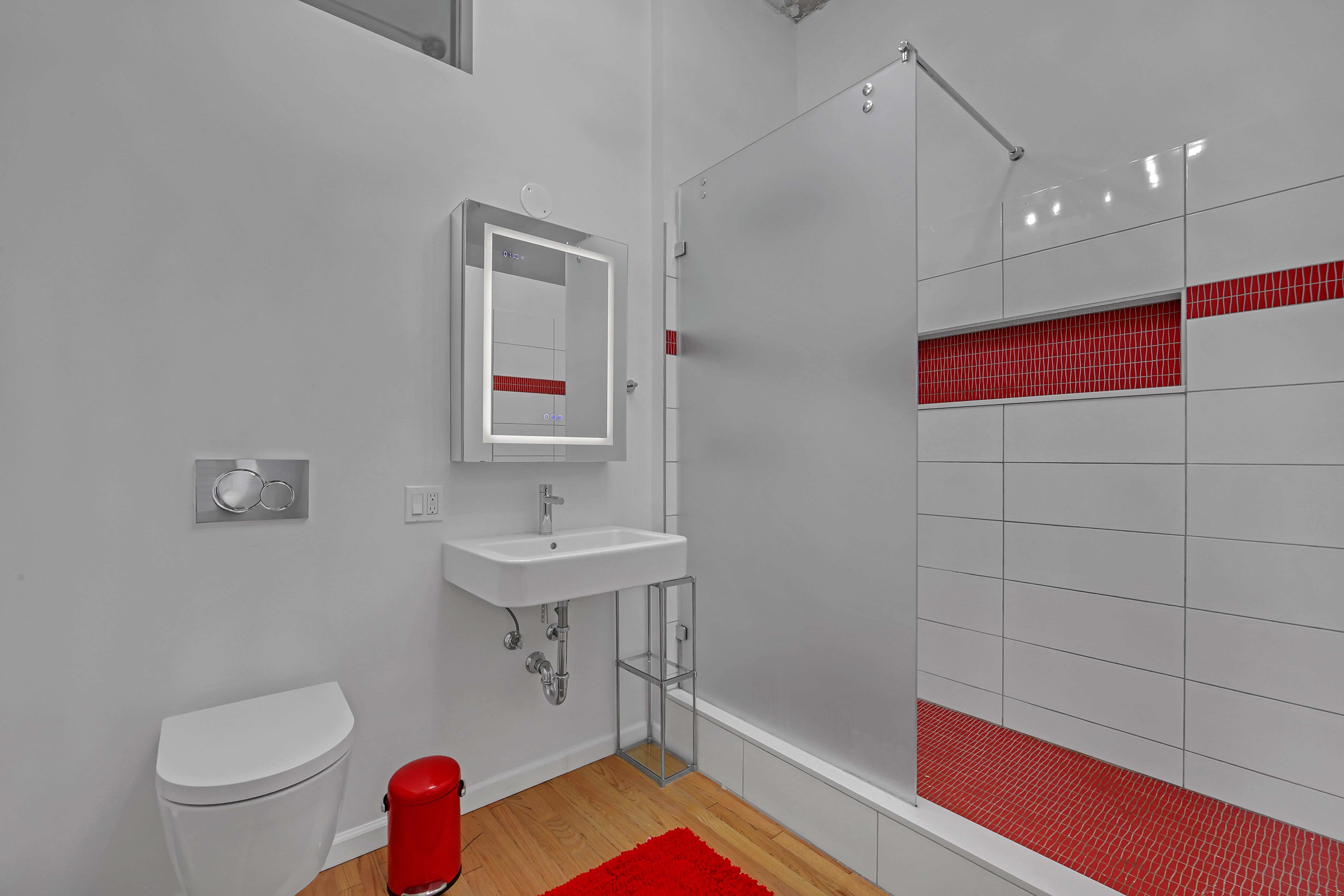 56 East 11th Street, Unit 7 Manhattan, NY 10003 - Photo 13 of 16 a bathroom with a sink and a mirror