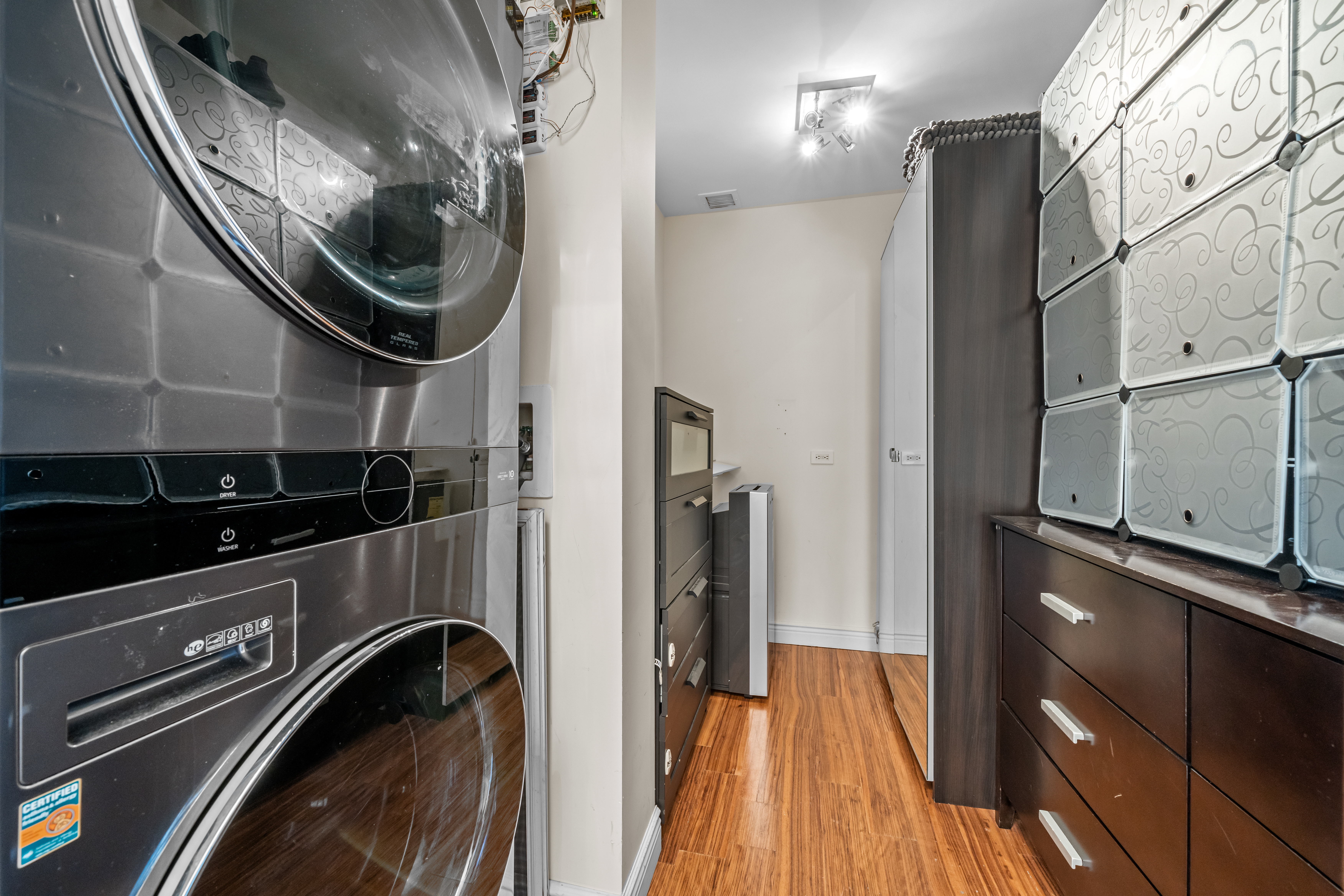 105 Oceana Drive East, Unit PH1D Brooklyn, NY 11235 - Photo 18 of 27 a close view of water heater and racks
