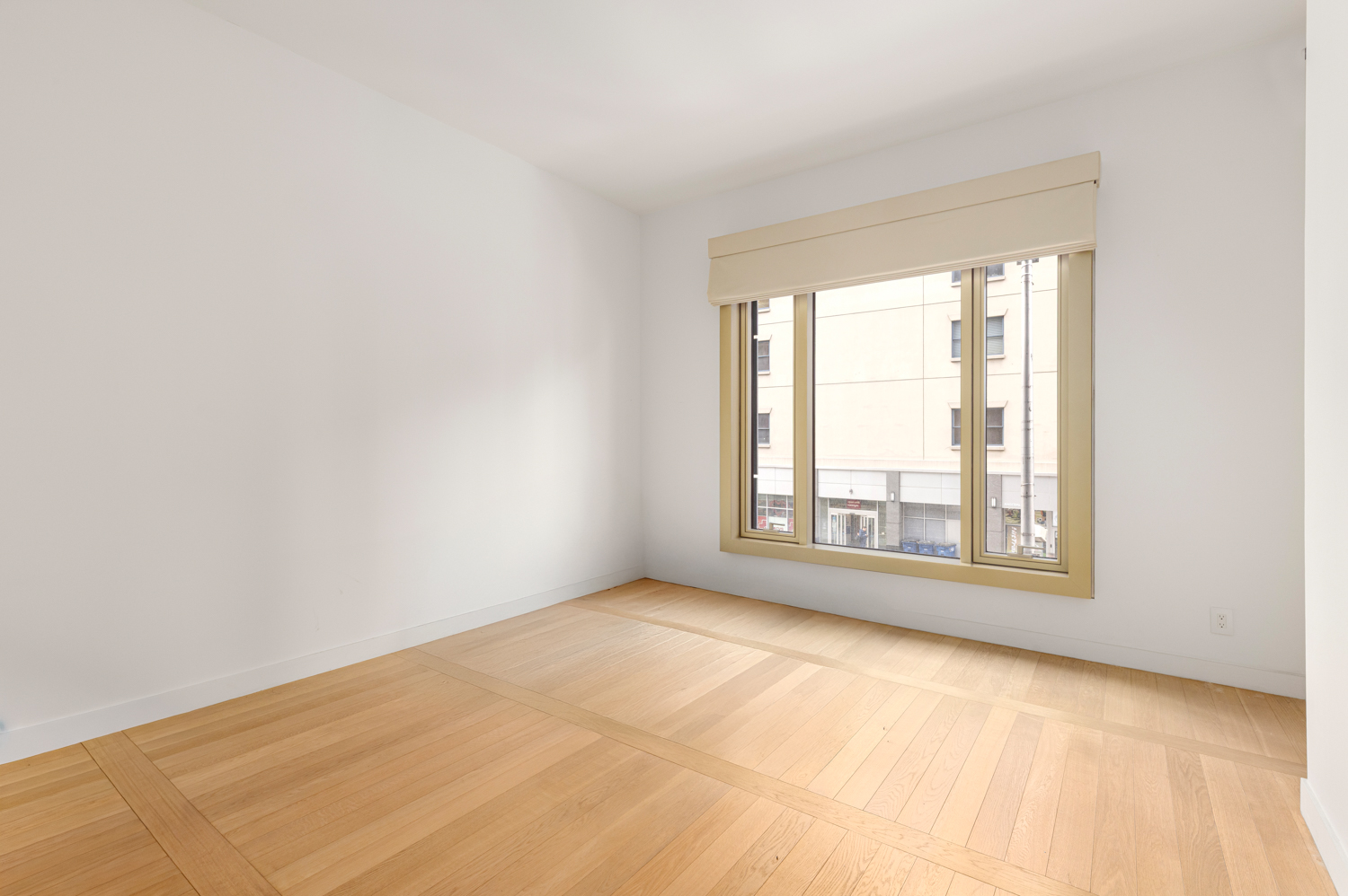 30 Warren Street, Unit 2A Manhattan, NY 10007 - Photo 6 of 10 an empty room with a window