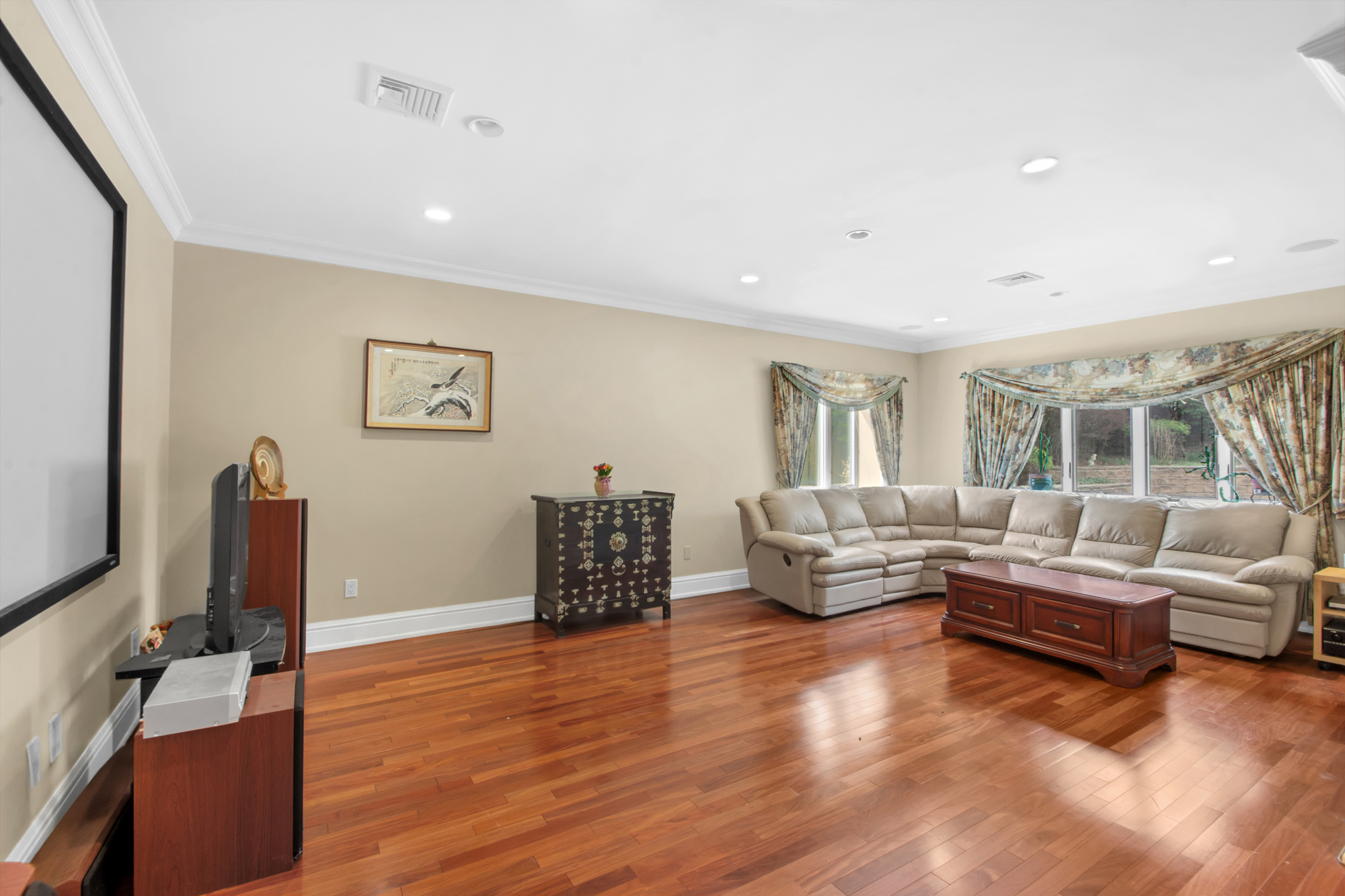 68 Circle Road Staten Island, NY 10304 - Photo 11 of 38 a living room with furniture and a flat screen tv