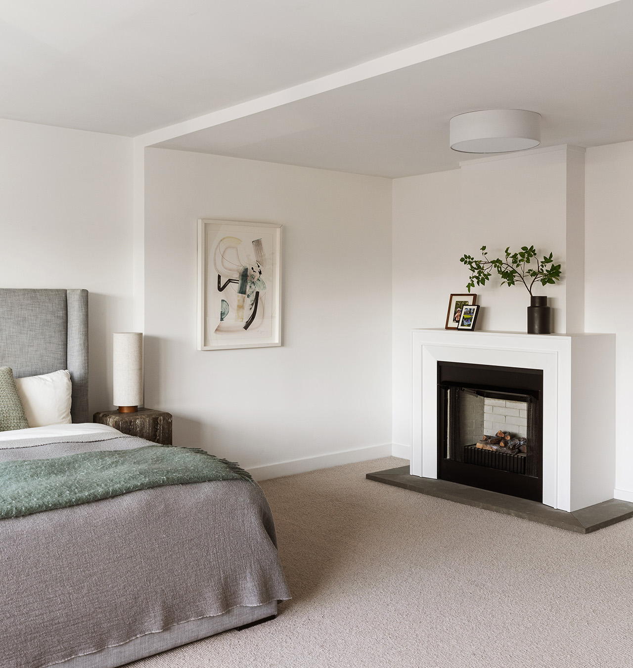 101 West 12th Street, Unit 8RS Manhattan, NY 10011 - Photo 9 of 19 a bedroom with a bed and a fireplace