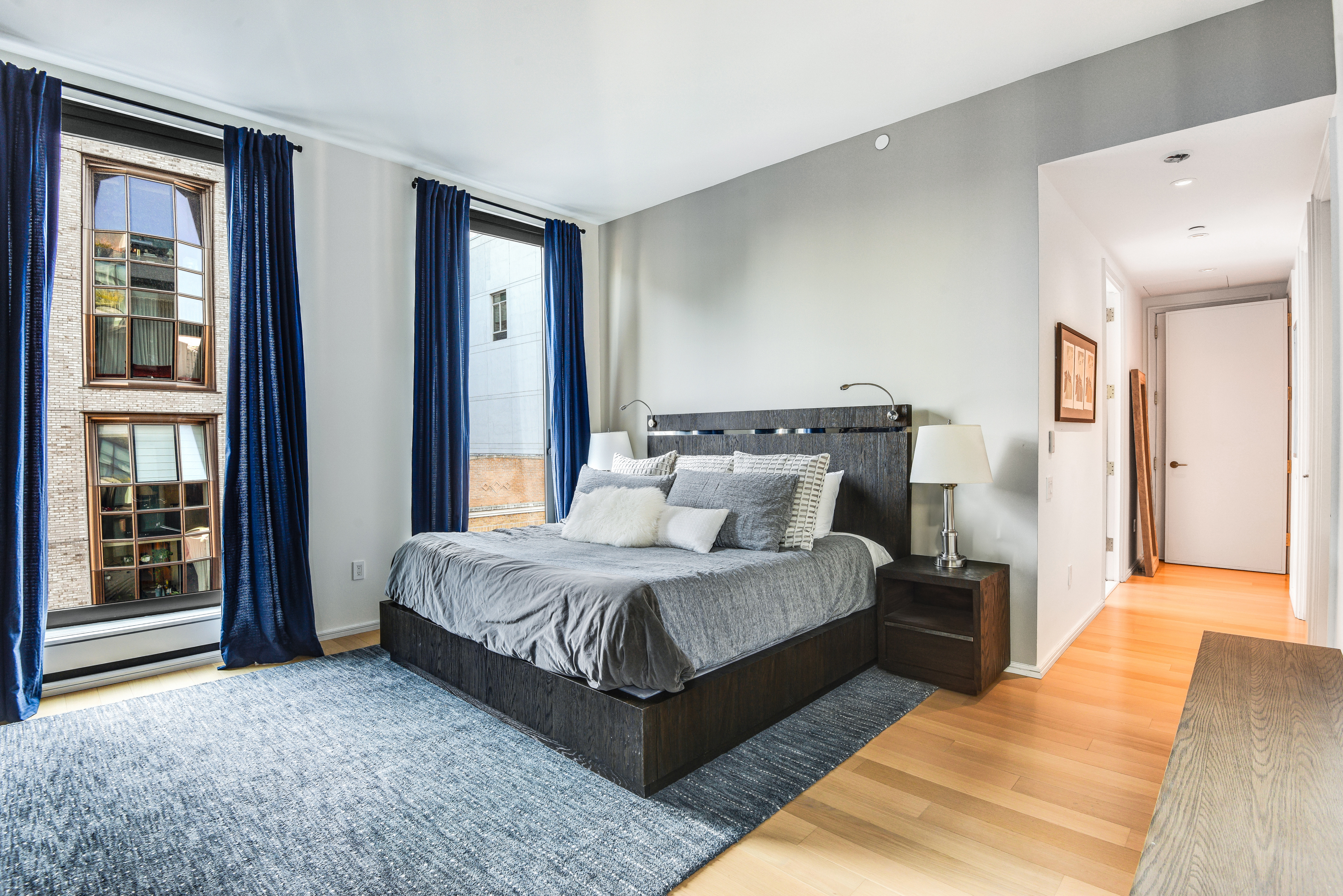 505 West 19th Street, Unit 7W Manhattan, NY 10011 - Photo 14 of 31 a spacious bedroom with a bed and window