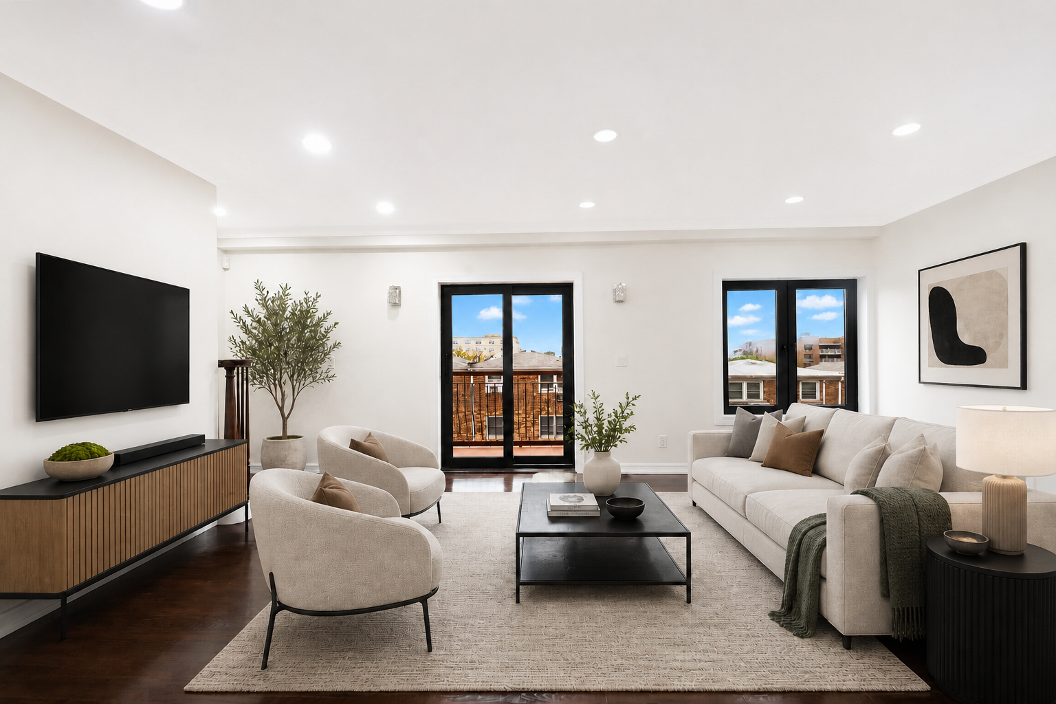 3165 Emmons Avenue, Unit PH3N Brooklyn, NY 11235 - Photo 1 of 14 a living room with furniture and a flat screen tv