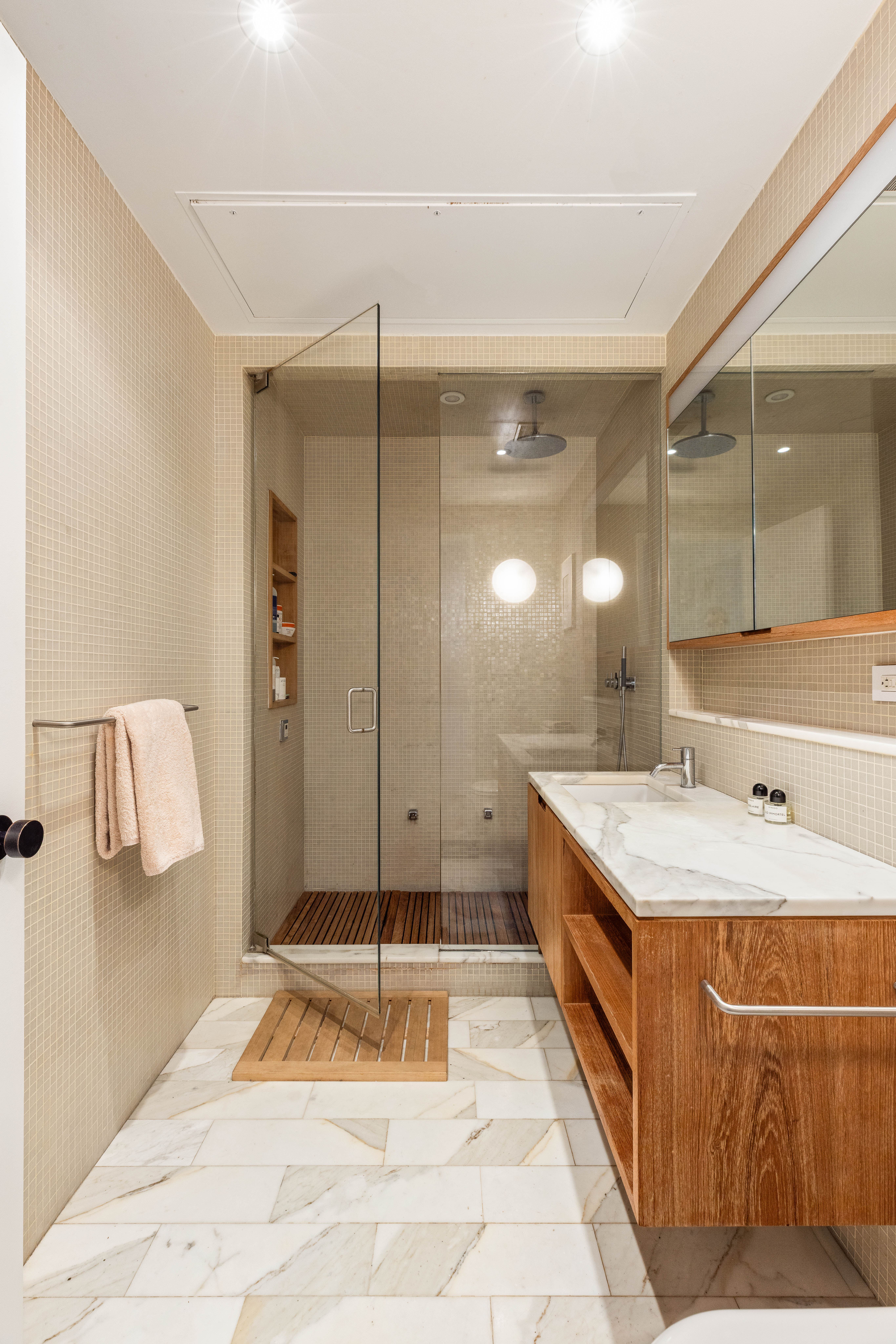 456 West 19th Street, Unit 2/3F Manhattan, NY 10011 - Photo 8 of 14 a spacious bathroom with a tub sink and mirror