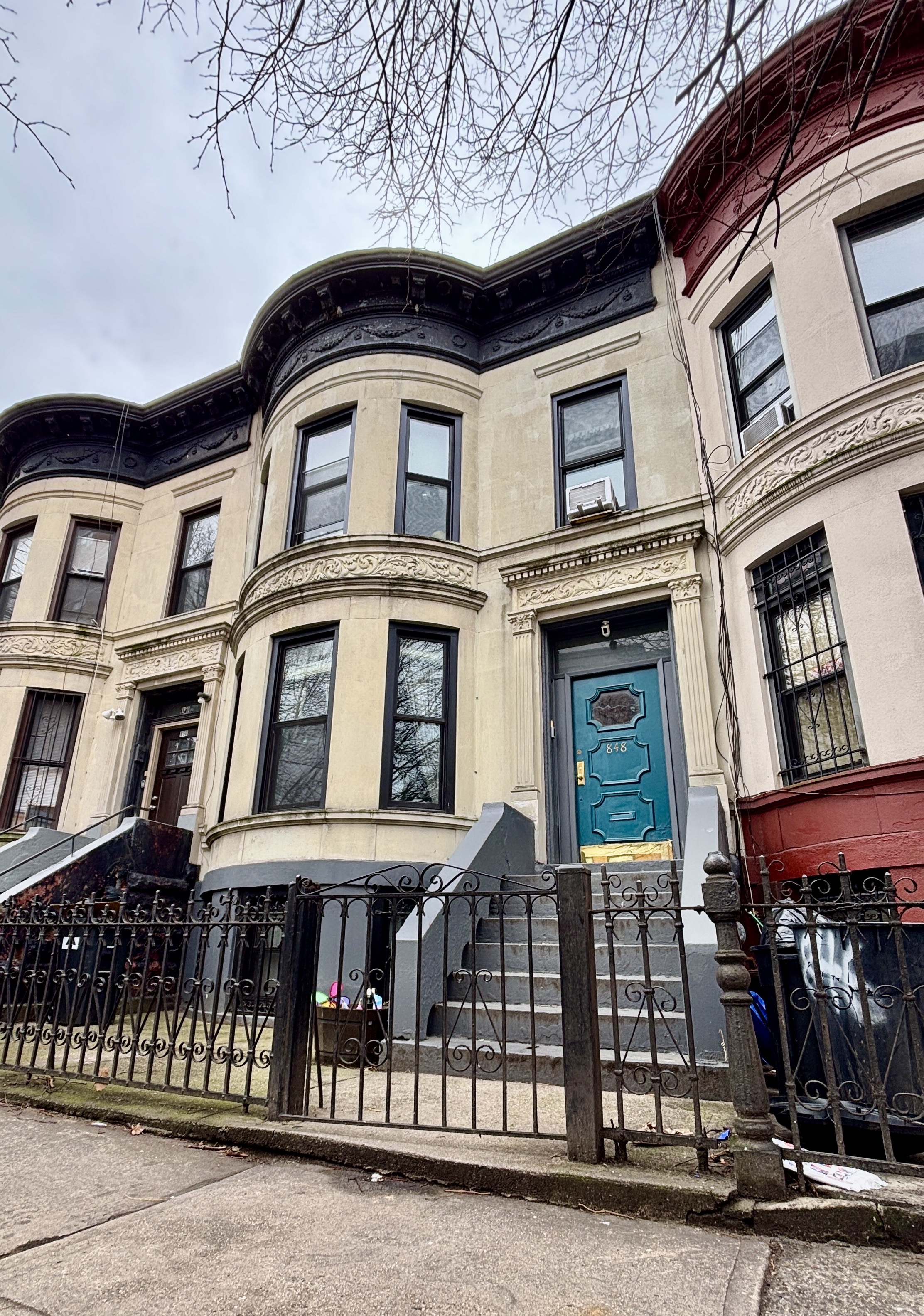 848 Macon Street, Unit PARLOR Brooklyn, NY 11233 - Photo 9 of 10 a front view of a building with glass windows
