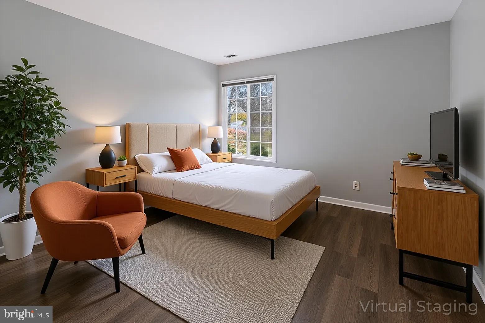 14603 Edelmar Drive, Unit 132A Silver Spring, MD 20906 - Photo 15 of 52 a bedroom with a bed and a chair