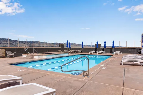 a view of a swimming pool with a chair