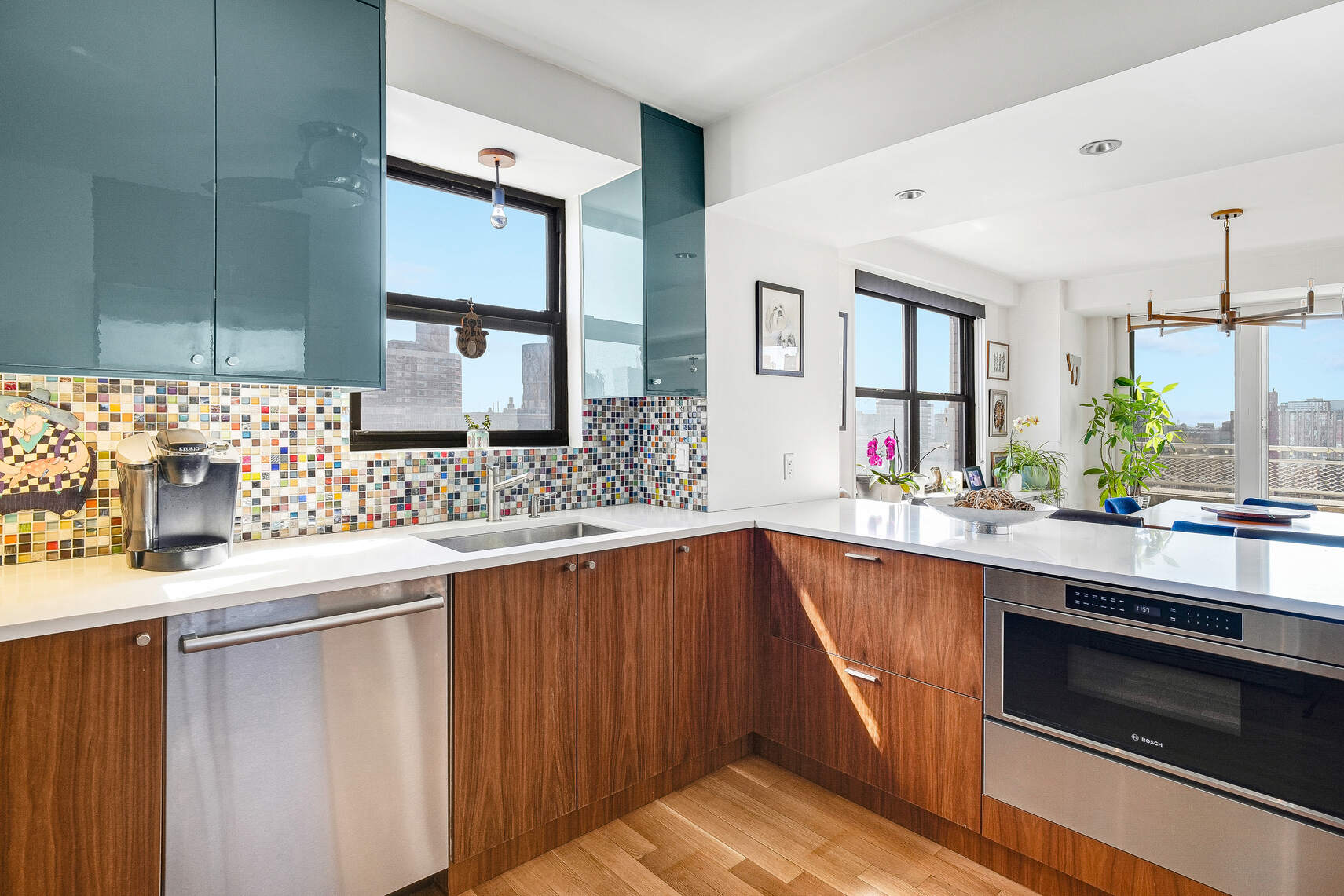 201 East 28th Street, Unit 21BC Manhattan, NY 10016 - Photo 6 of 24 a kitchen with stainless steel appliances a sink and cabinets