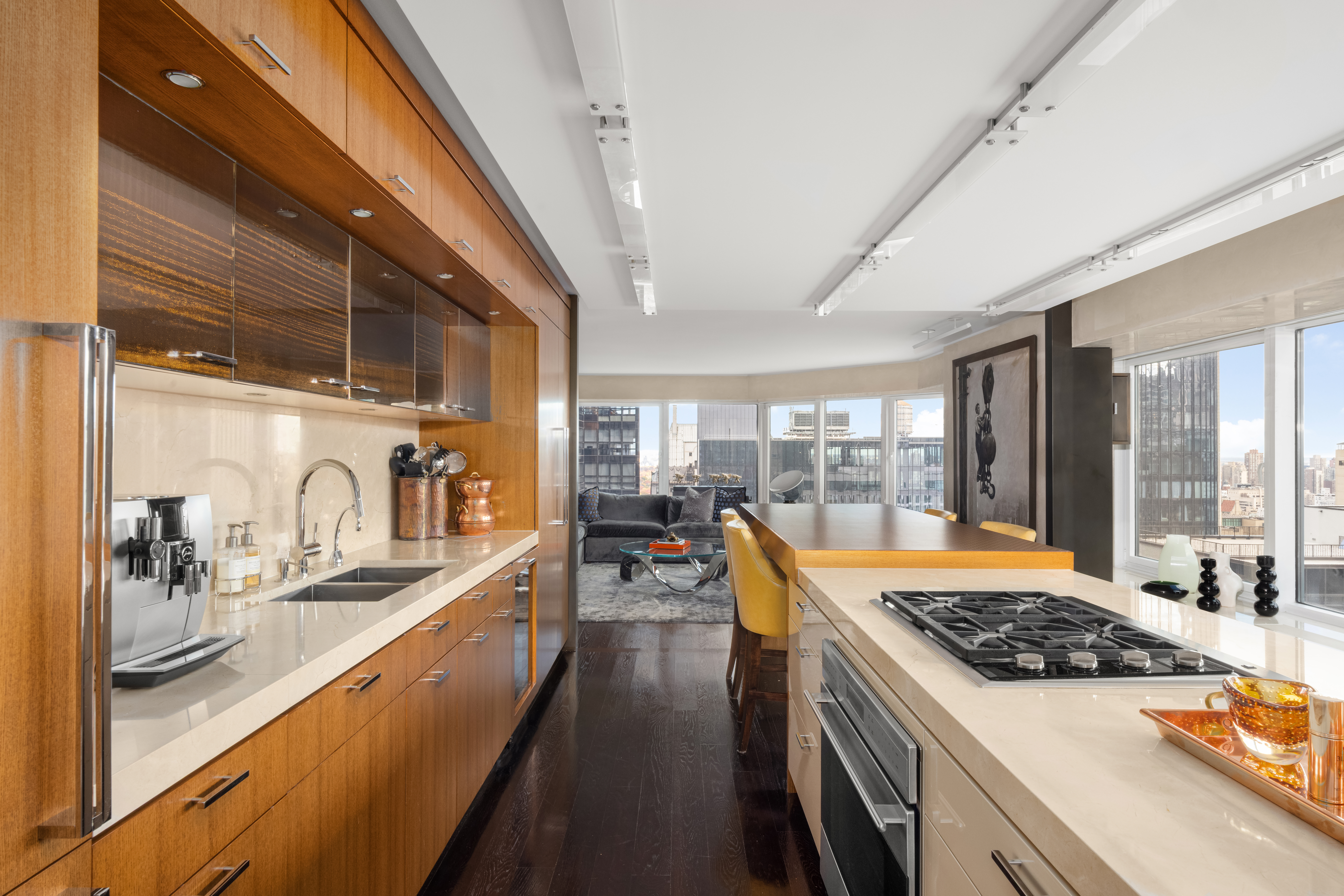 150 West 56th Street, Unit 3901 Manhattan, NY 10019 - Photo 6 of 25 a kitchen with stainless steel appliances granite countertop a sink stove and refrigerator