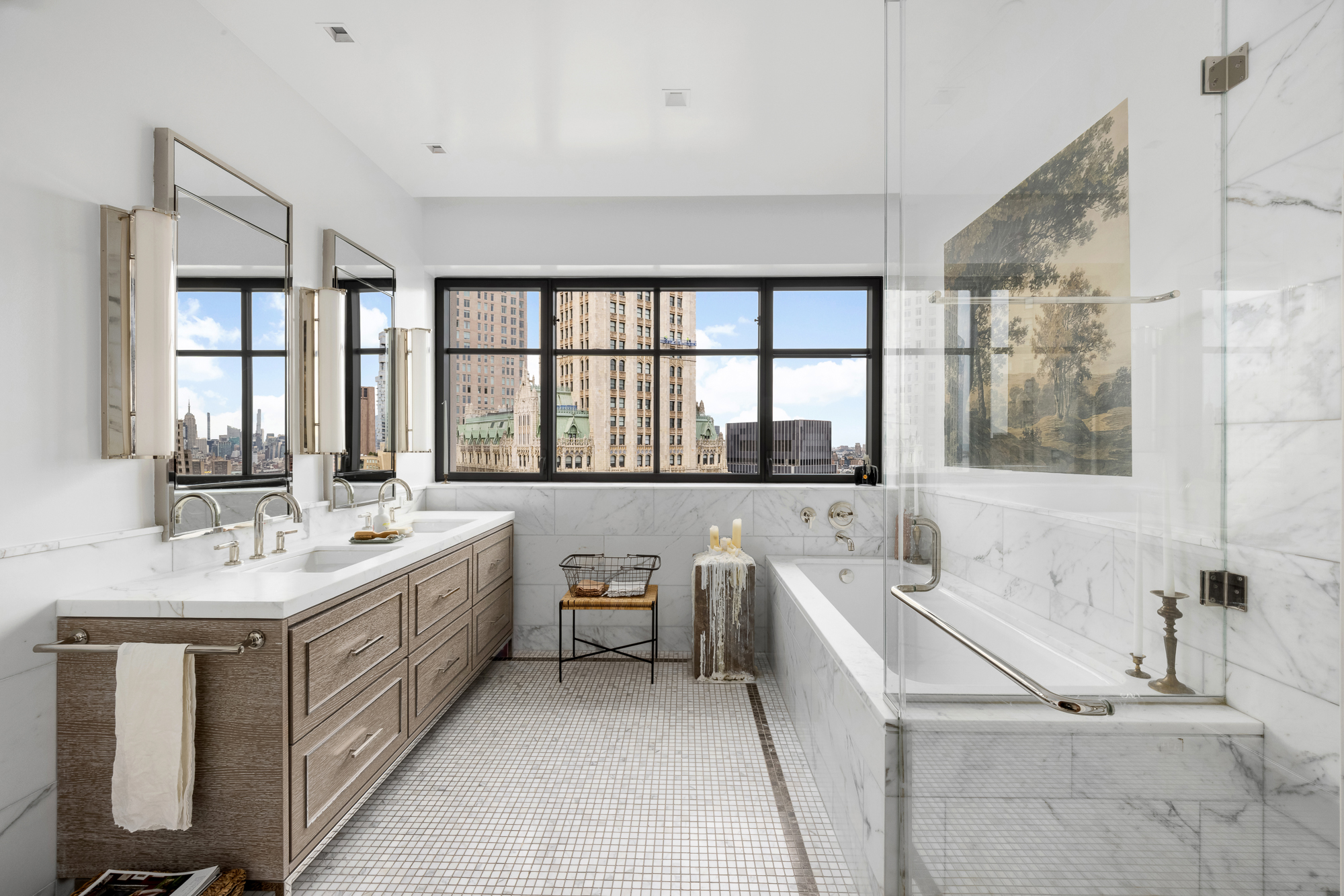 25 Park Row, Unit 29A Manhattan, NY 10038 - Photo 16 of 23 a bathroom with a double vanity sink a large mirror and a bathtub