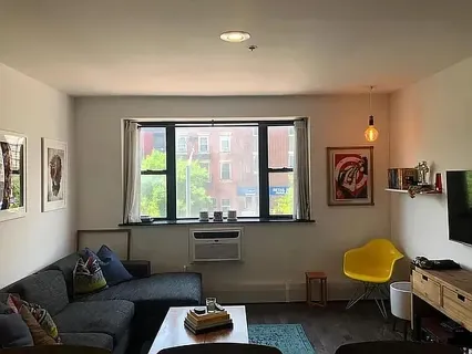 a living room with furniture and a window