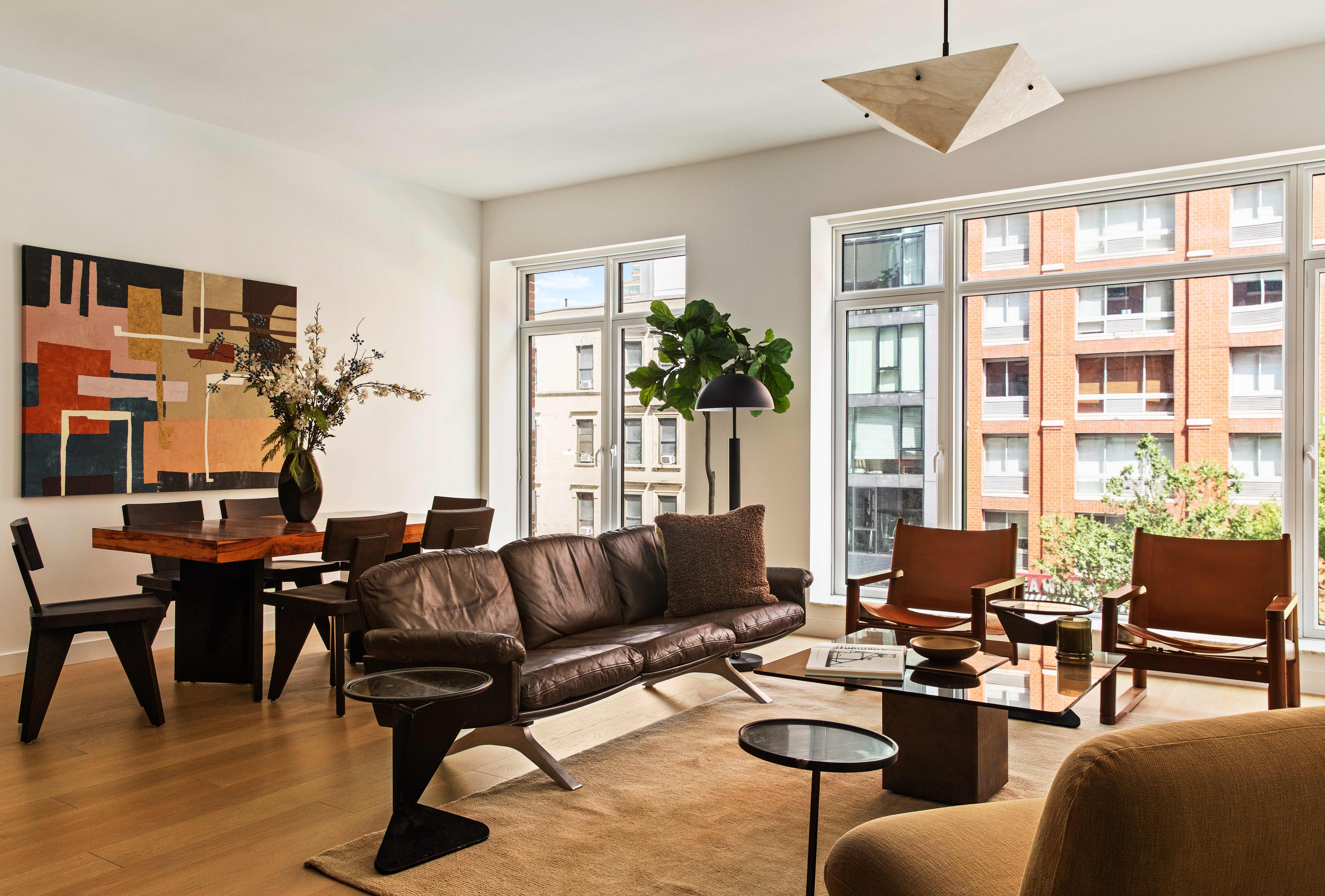 555 West 22nd Street, Unit 4CE Manhattan, NY 10011 - Photo 2 of 21 a living room with furniture and a large window
