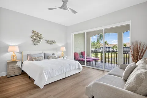 a bedroom with a bed and a couch