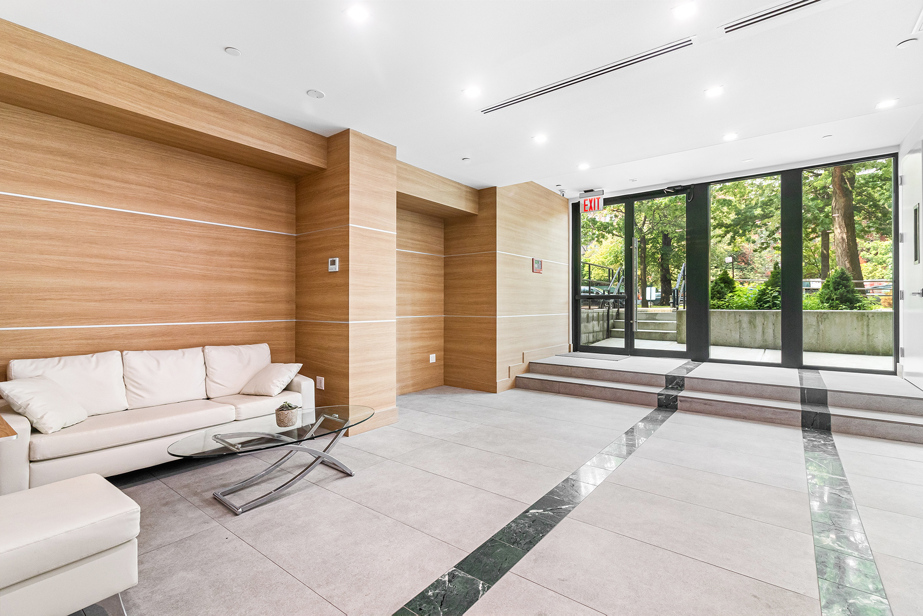 309 Ocean Parkway, Unit 4F Brooklyn, NY 11218 - Photo 11 of 14 a living room with furniture and large windows