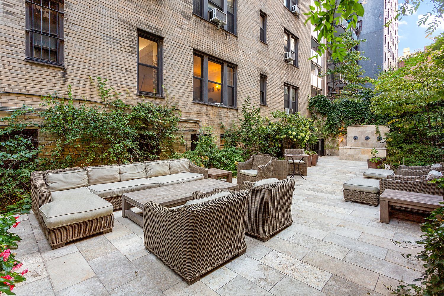 127 West 96th Street, Unit 4D Manhattan, NY 10025 - Photo 12 of 14 a view of a patio with couches and potted plants