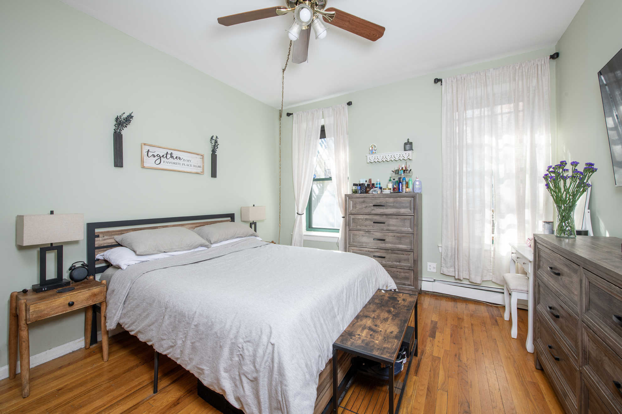352 West 117th Street, Unit 1E Manhattan, NY 10026 - Photo 7 of 13 a bedroom with a bed and a dresser