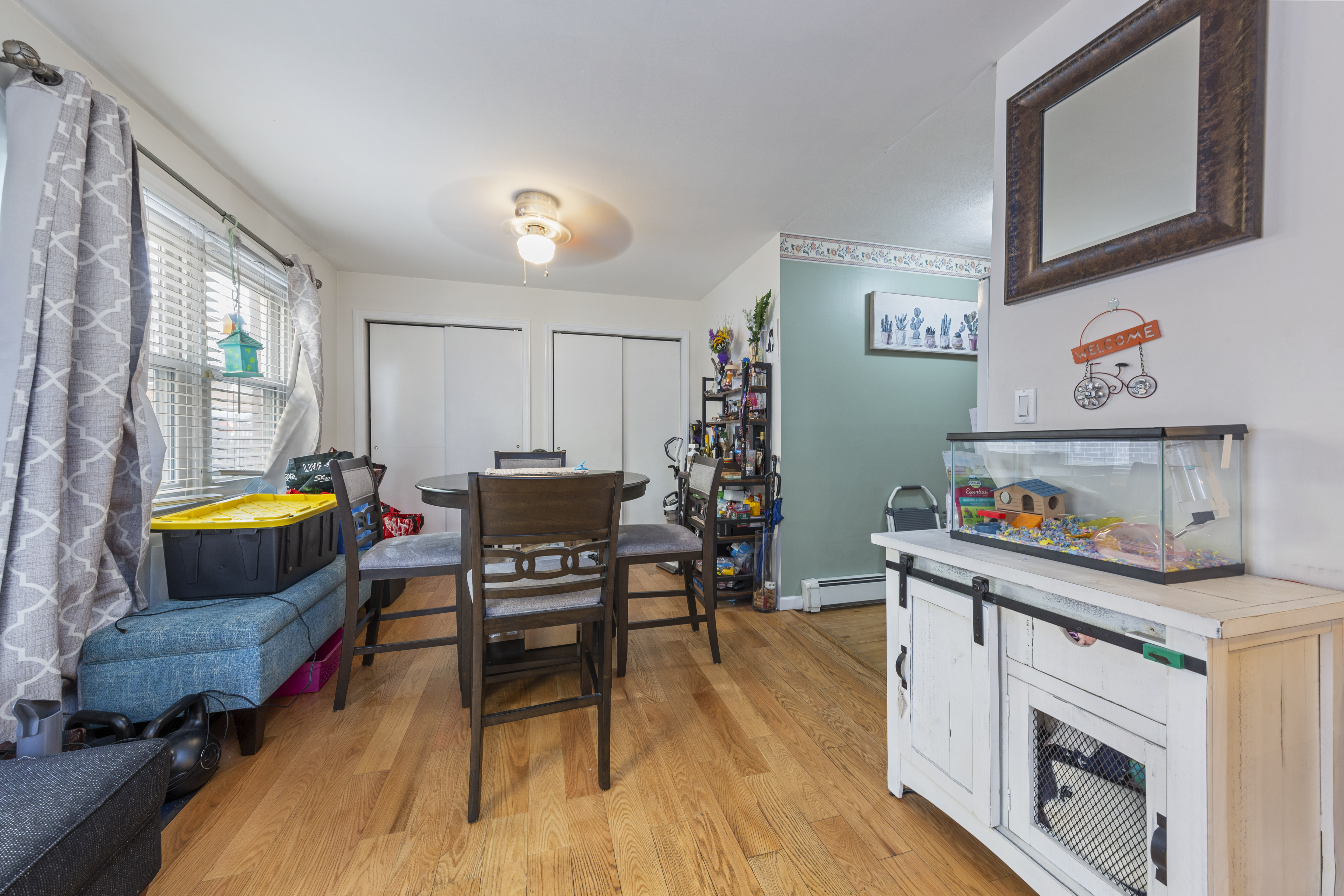 240-47 68th Avenue Queens, NY 11362 - Photo 17 of 39 a living room with furniture and a wooden floor