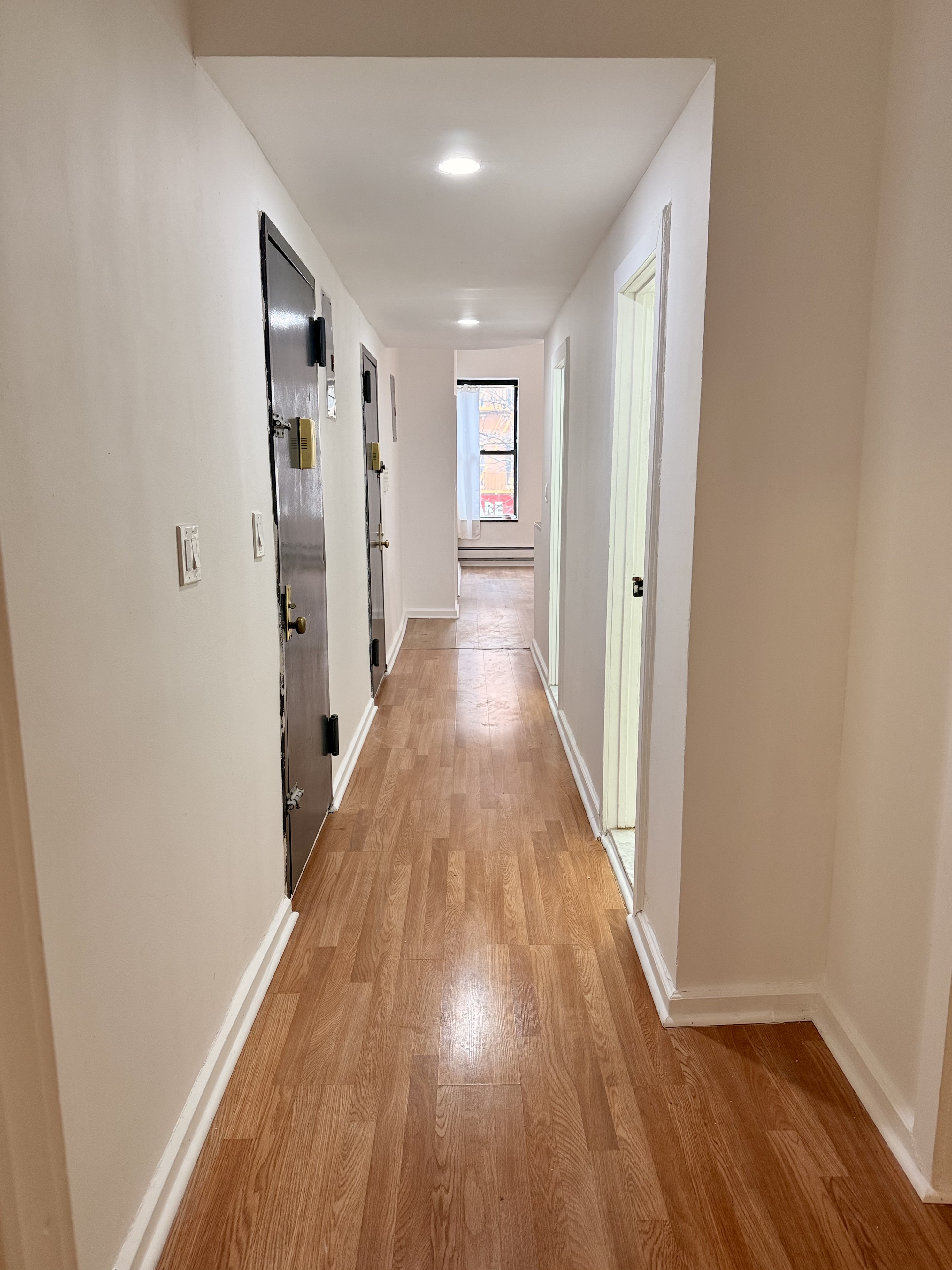 1997 3rd Avenue, Unit 1A Manhattan, NY 10029 - Photo 21 of 23 a view of a hallway with wooden floor