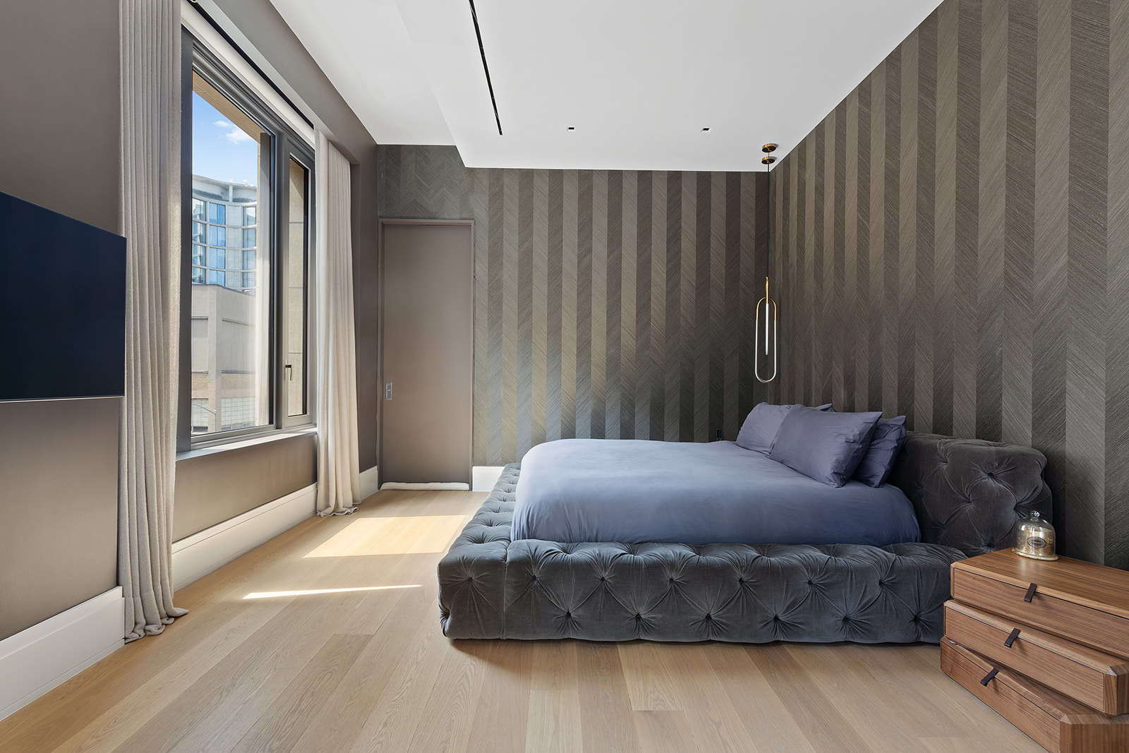 601 Washington Street, Unit 3W Manhattan, NY 10014 - Photo 6 of 15 a bedroom with a bed and a window