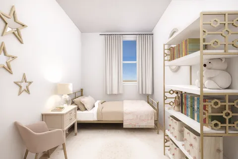 a bedroom with furniture and a large window