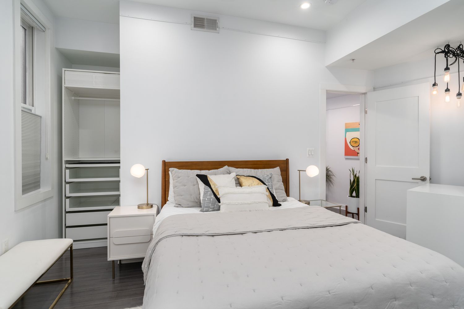 a bedroom with a bed and a chair