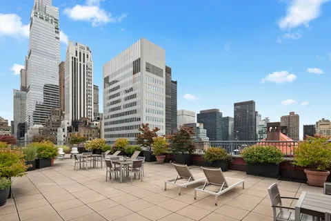 a view of a patio with chairs and tables