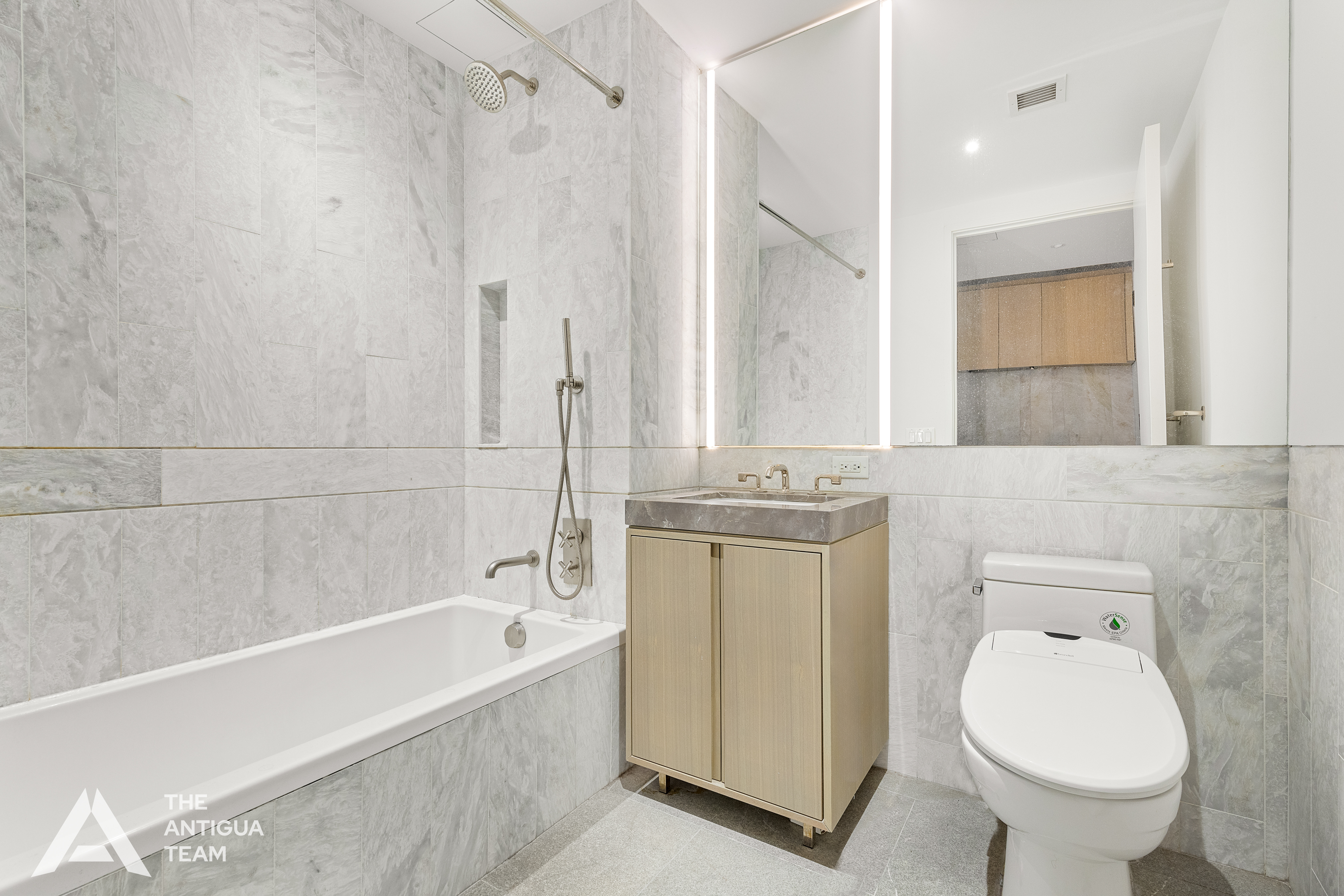 10 Nevins Street, Unit 3H Brooklyn, NY 11217 - Photo 3 of 12 a bathroom with a sink toilet and shower