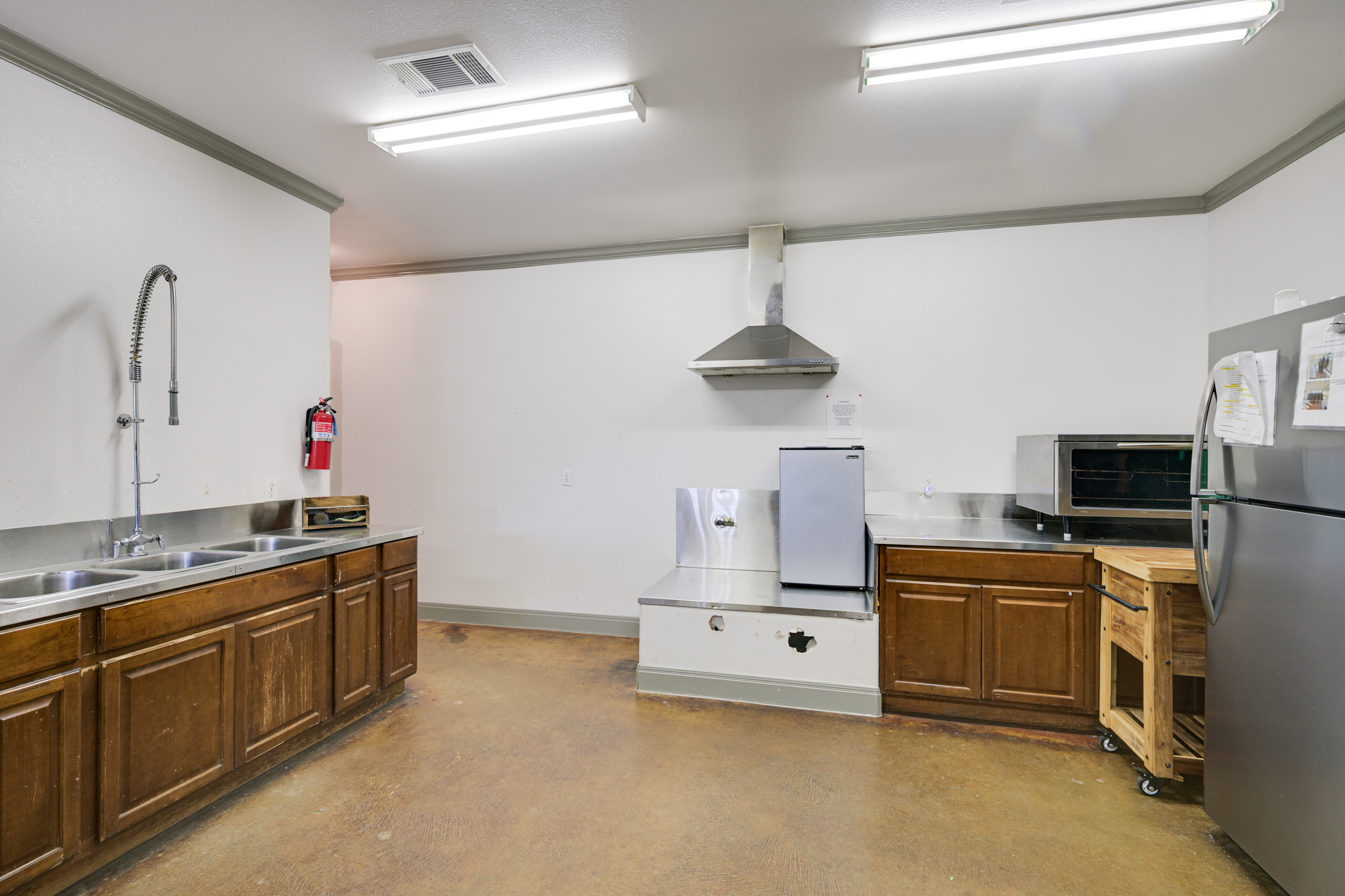 14913 Murfin Road Austin, TX 78734 - Photo 35 of 40 a kitchen with kitchen island stainless steel appliances a sink stove and refrigerator