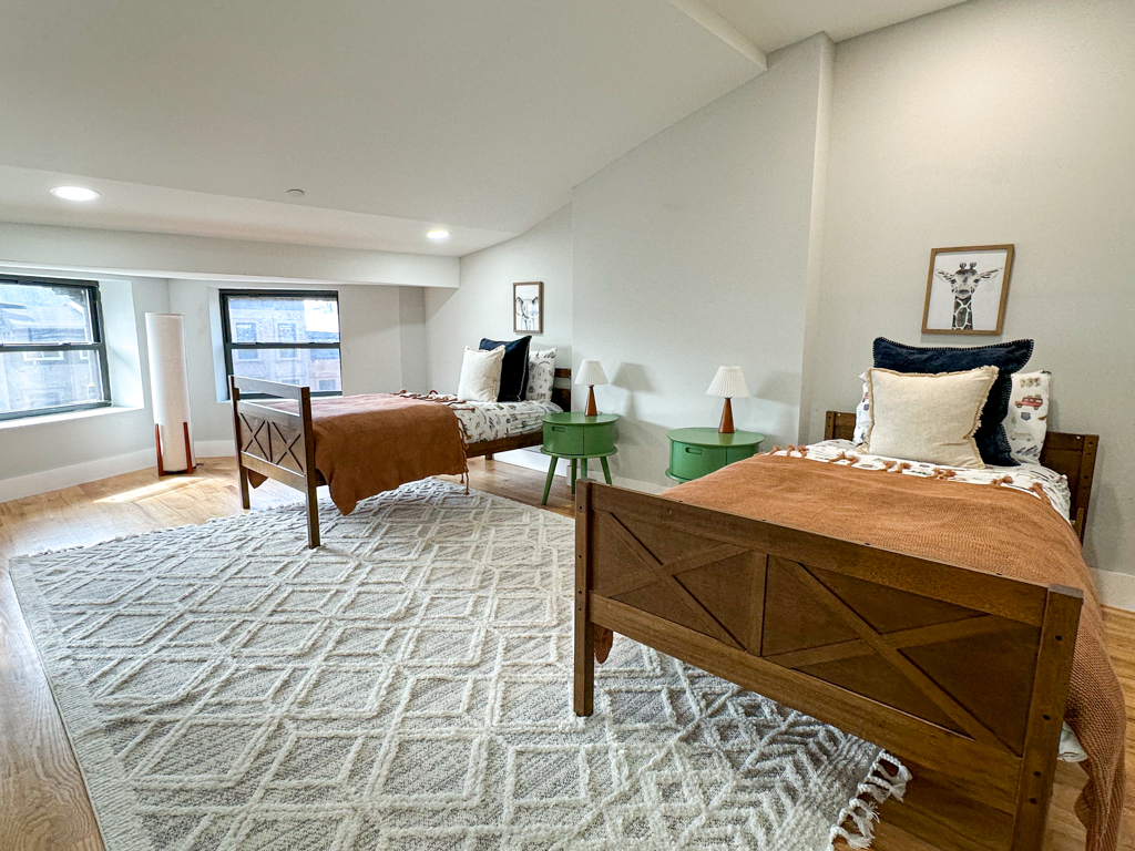 497 Madison Street Brooklyn, NY 11221 - Photo 11 of 19 a bedroom with a large bed and a window