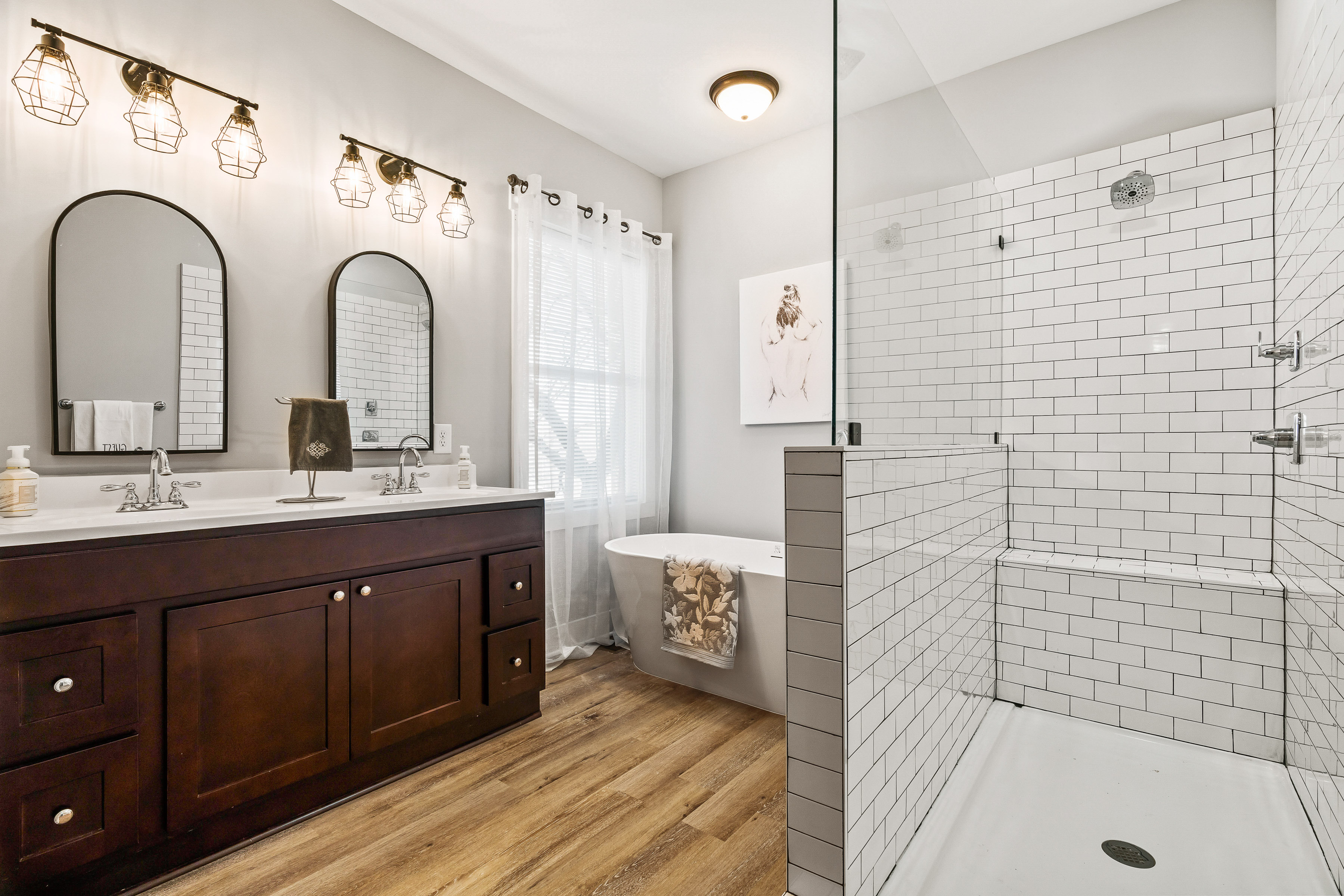 Happy Hollow Road Goodlettsville, TN 37072 - Photo 59 of 203 a bathroom with a double vanity sink a mirror a bathtub and shower