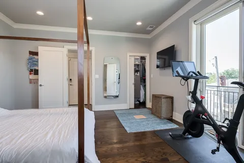 a room with a bed and a mirror