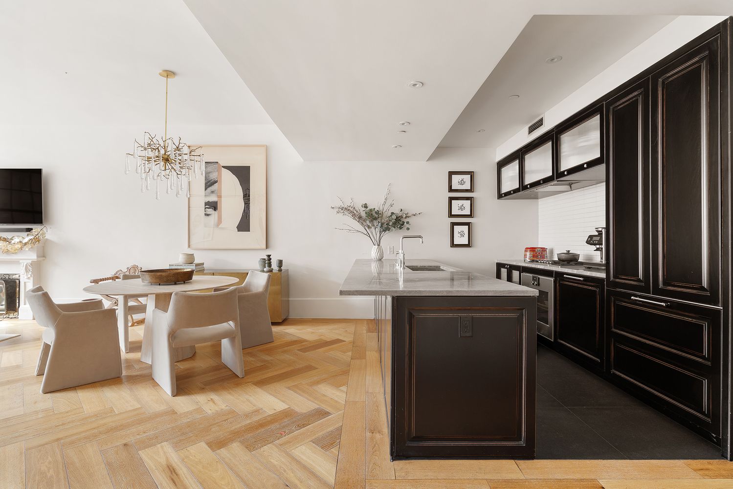 a living room with furniture a large window and a fireplace