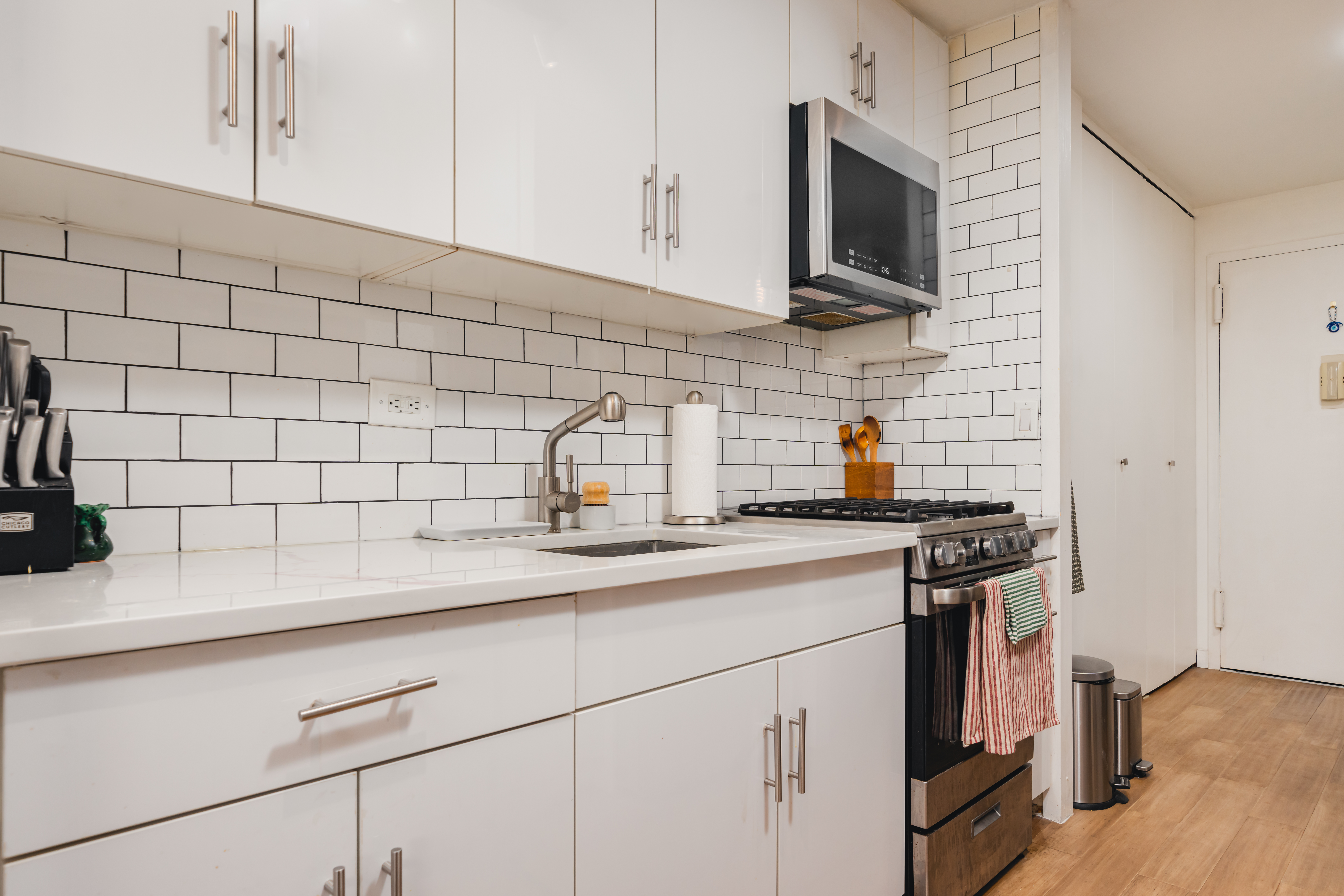 75 Henry Street, Unit 6D Brooklyn, NY 11201 - Photo 3 of 11 a kitchen with a sink stove and cabinets