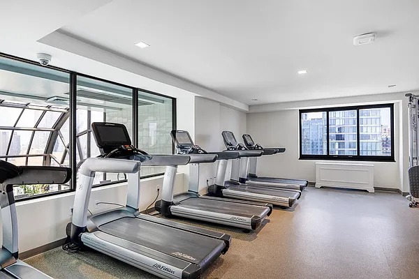 200 Rector Place, Unit 6P Manhattan, NY 10280 - Photo 6 of 10 a view of a room with gym equipment