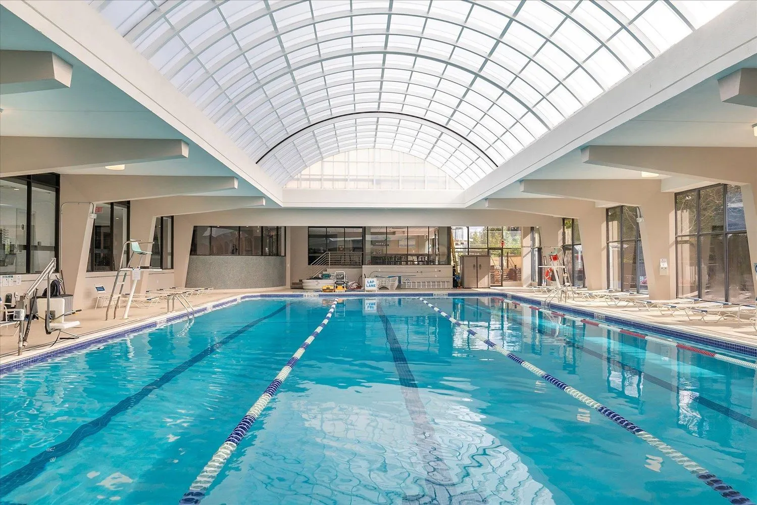 a view of swimming pool with outdoor seating