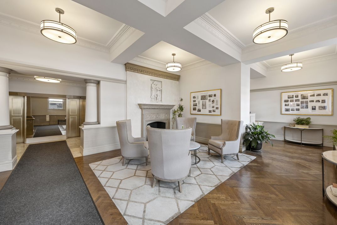 305 2nd Avenue, Unit 521 Manhattan, NY 10003 - Photo 17 of 20 a living room with patio furniture and a fireplace
