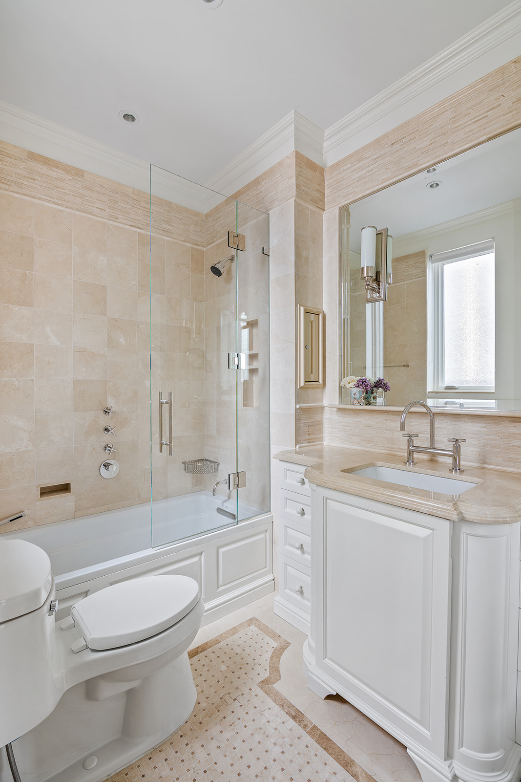 164 East 72nd Street, Unit PHC Manhattan, NY 10021 - Photo 9 of 17 a bathroom with a toilet a sink a tub and mirror