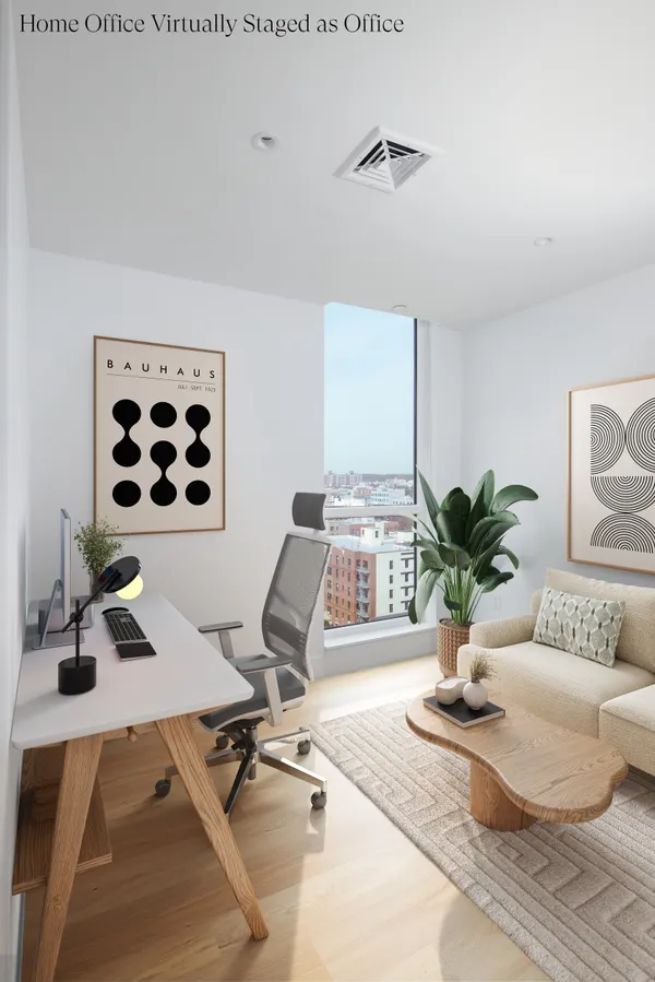 a living room with furniture and potted plant