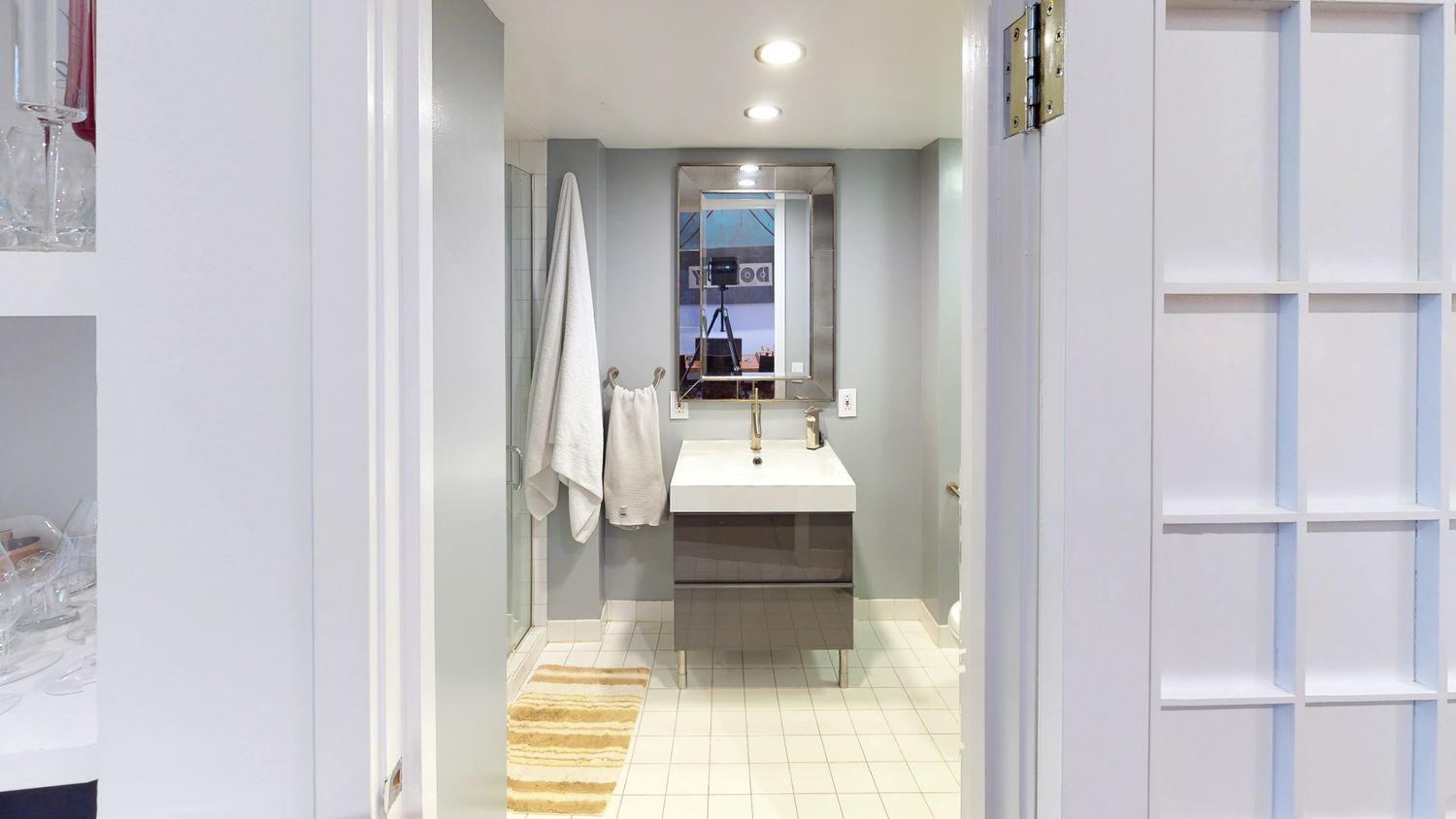 382 Lafayette Street, Unit 2 Manhattan, NY 10003 - Photo 16 of 19 a bathroom with a sink and mirror