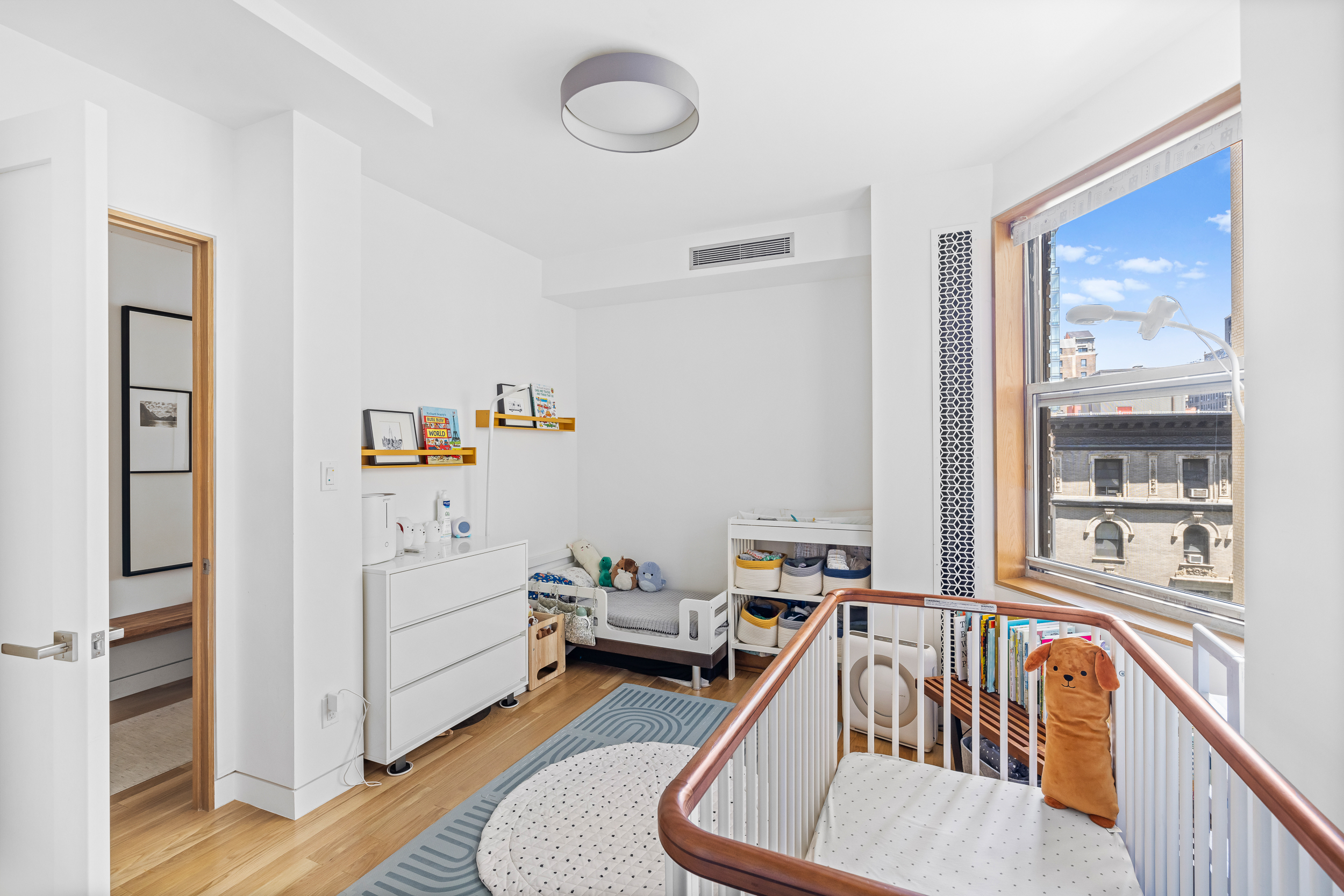240 West 98th Street, Unit 8D Manhattan, NY 10025 - Photo 8 of 12 a view of a livingroom with furniture and windows